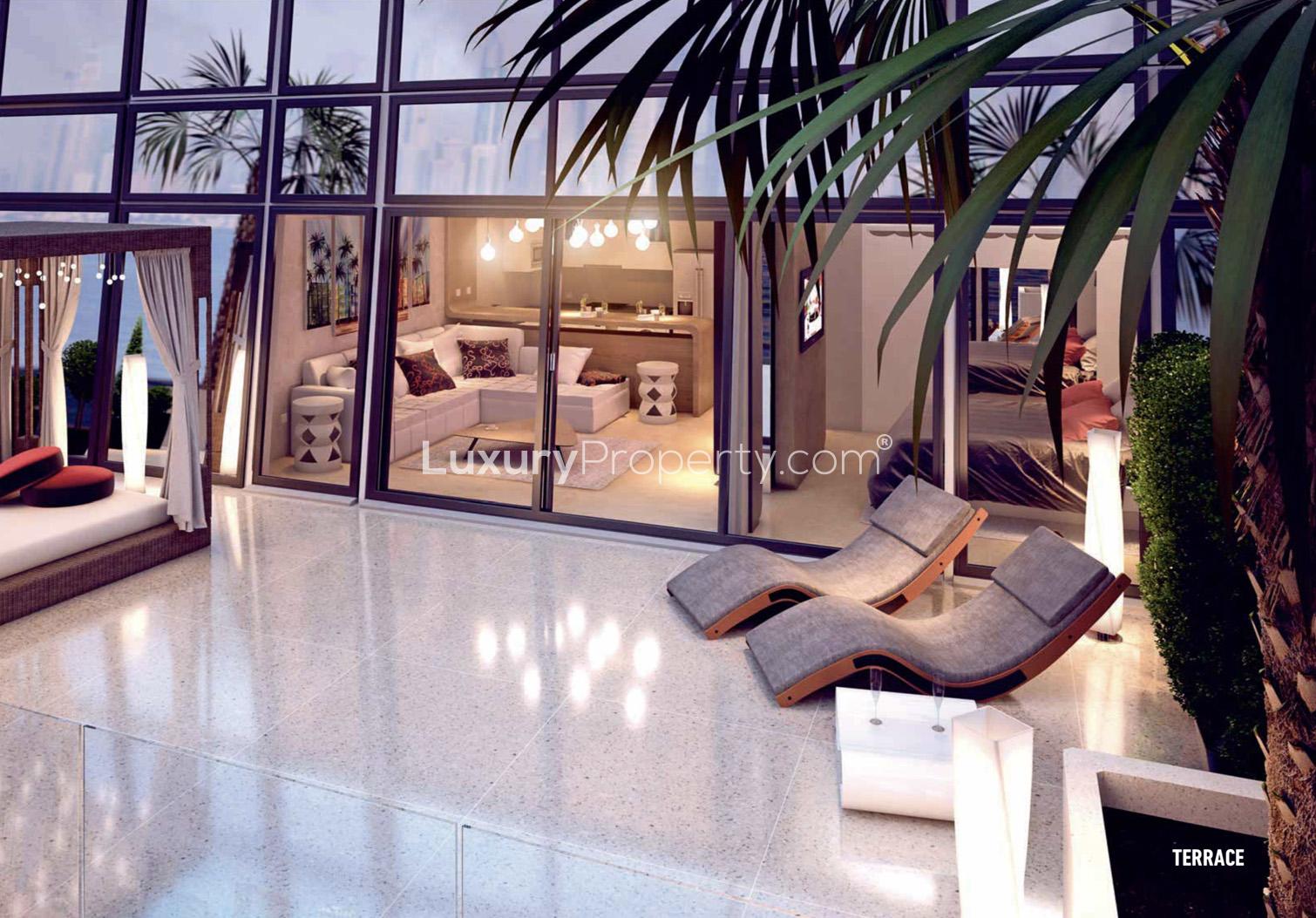 Rooftop pool with city skyline view at The Pad, Business Bay apartment