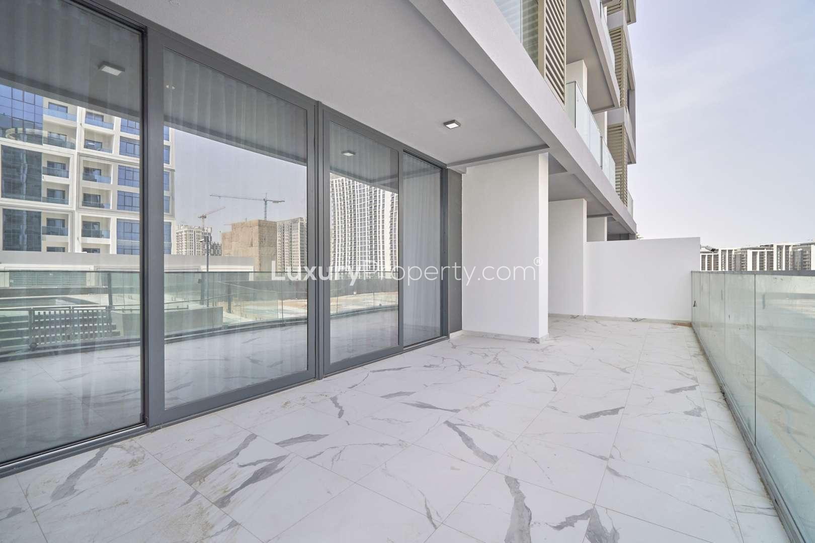 Modern kitchen and living area in two-bedroom apartment, Pinnacle Tower, Dubai Hills Estate