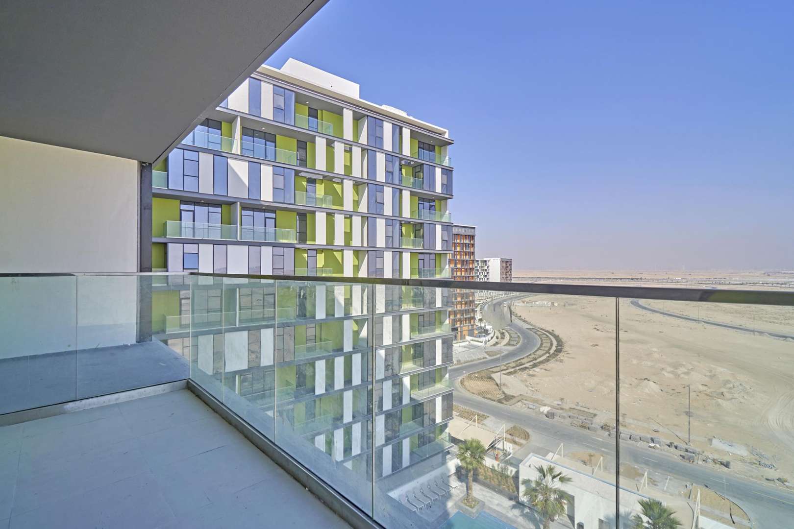 Empty living room in modern apartment, The Pulse Boulevard, Dubai South