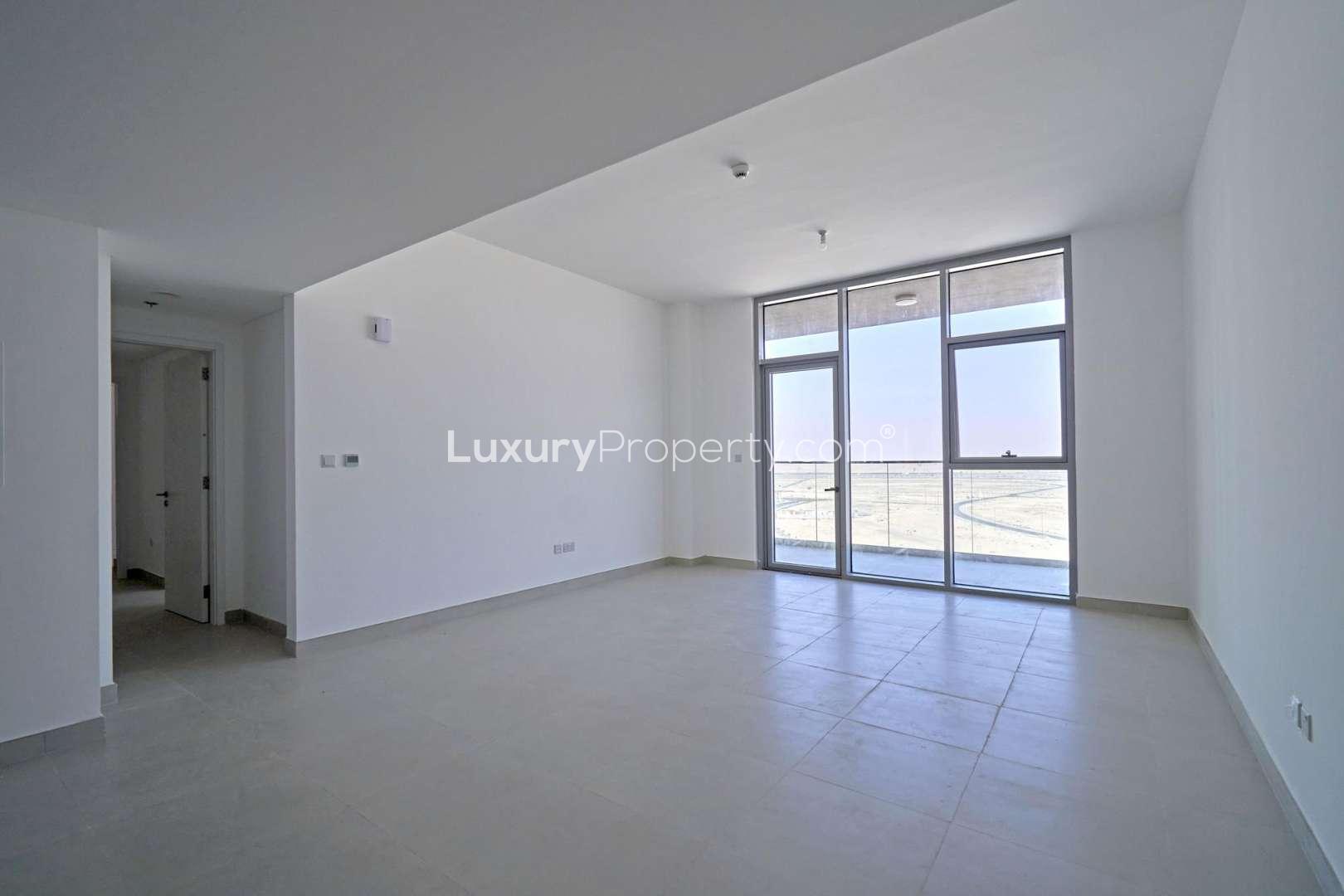 Modern apartment building exterior in The Pulse Boulevard, Dubai South, for sale