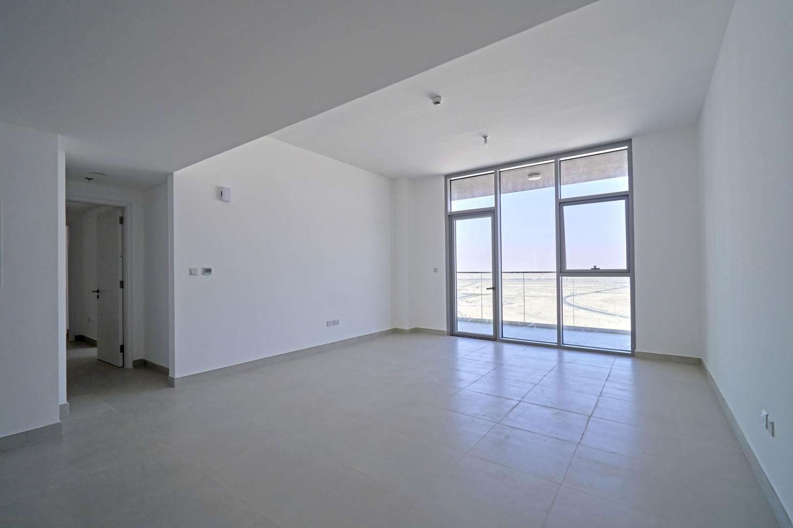 Modern apartment building exterior in The Pulse Boulevard, Dubai South, for sale