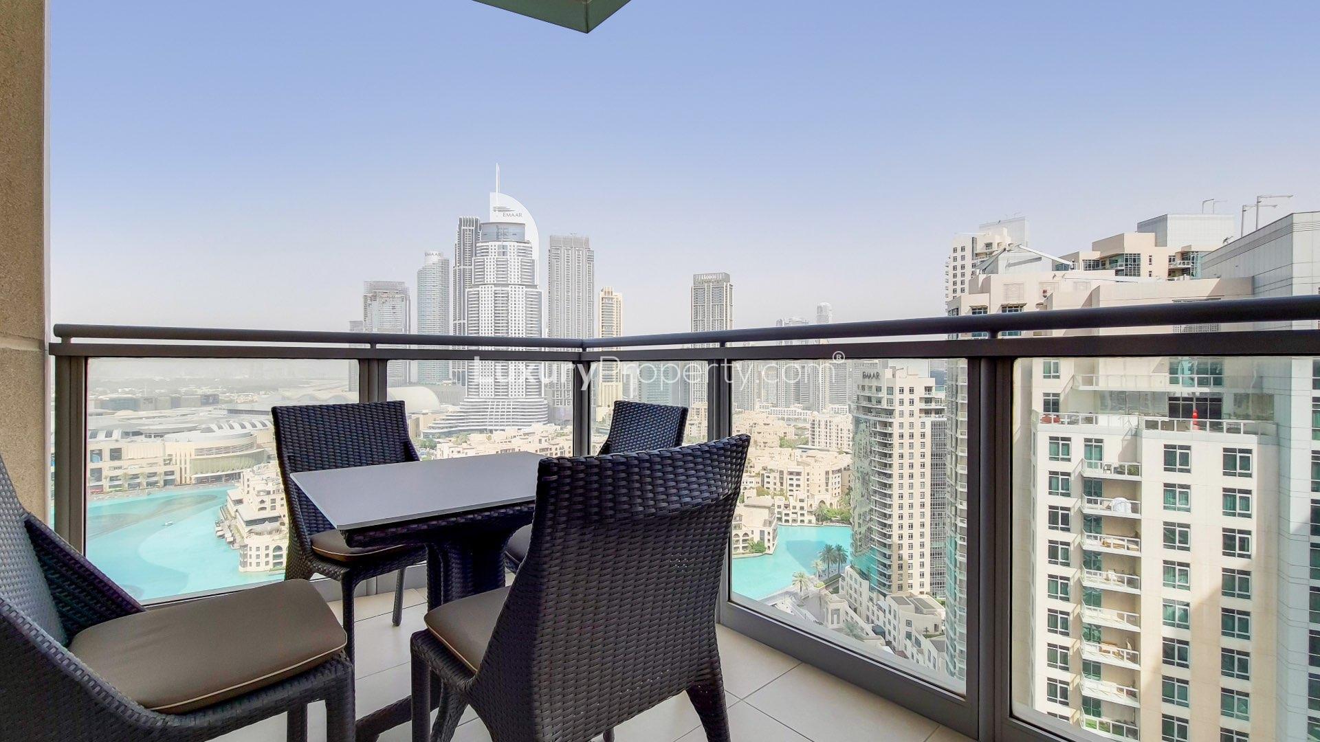 Alt text: "Downtown Dubai apartment with Burj Khalifa and Fountain views, The Residences, for sale.",Balcony view of Burj Khalifa and fountains from upgraded Downtown Dubai apartment