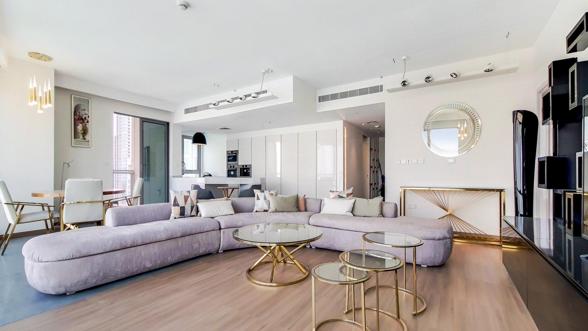 Modern living room in upgraded Downtown Dubai apartment, featuring elegant decor and spacious layout