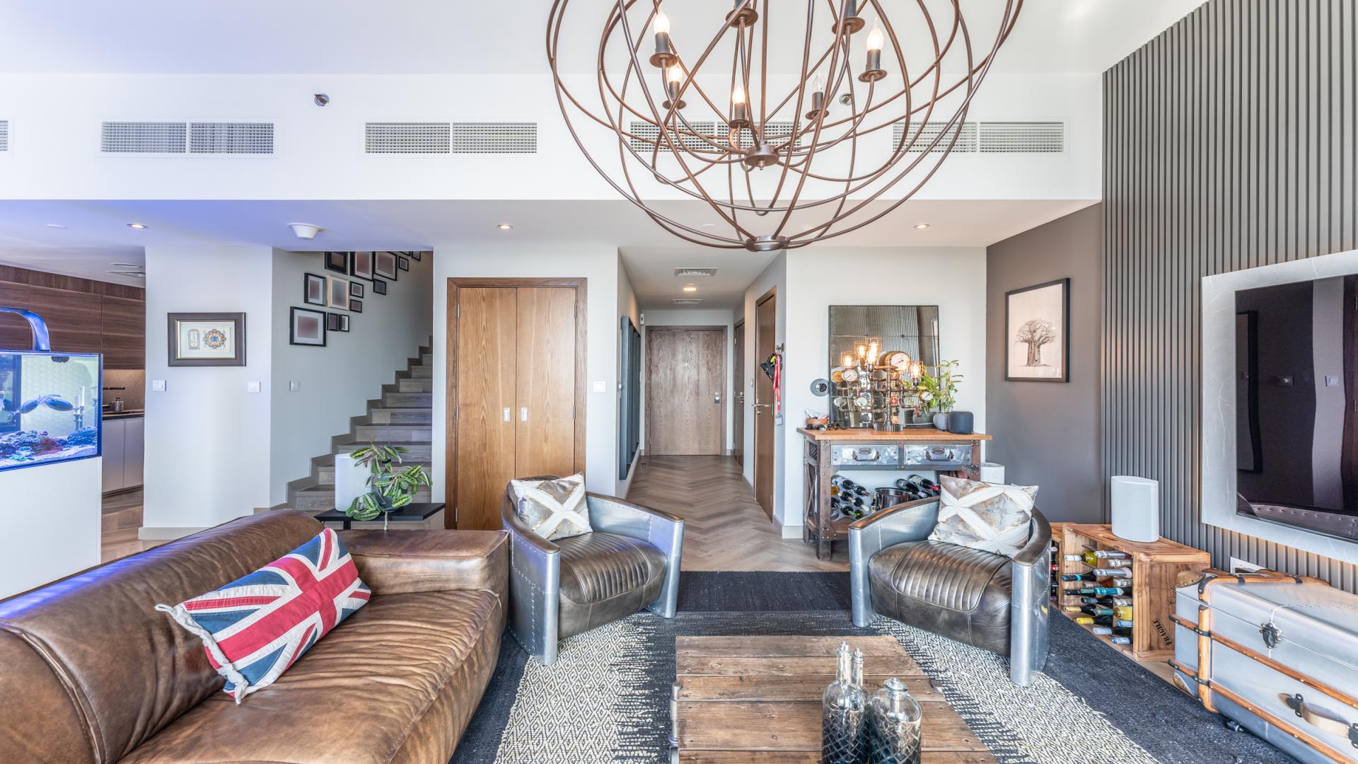 Modern living room in upgraded two-bed duplex, Hameni Tower, Jumeirah Village Circle