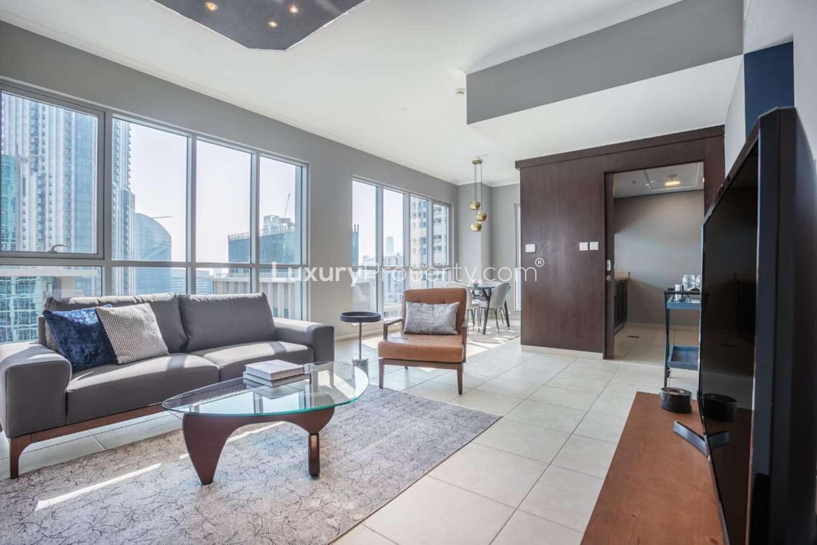 Modern kitchen with dark wood cabinets in Downtown Dubai apartment for sale, The Residences