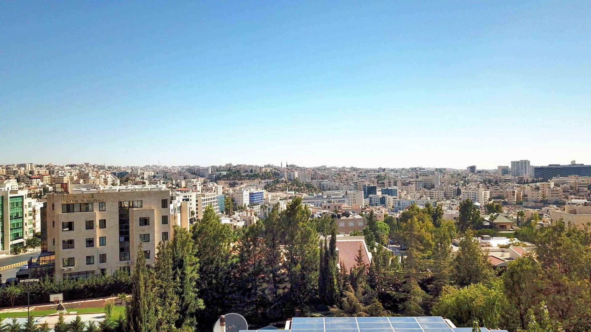 Skyline view of Amman cityscape at dusk from The Ritz-Carlton Residences, Amman