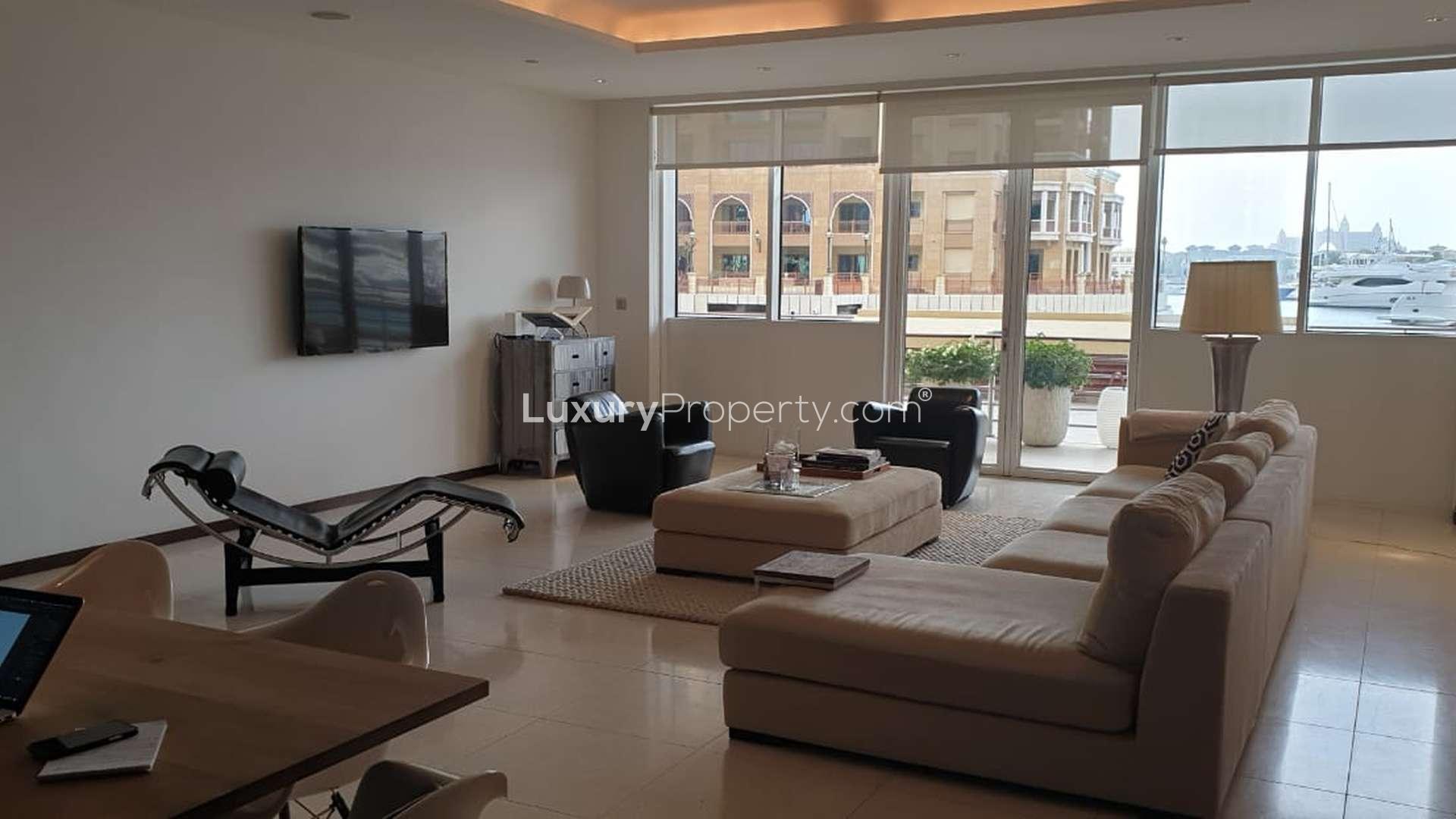 Modern kitchen in Tiara Residence apartment, Palm Jumeirah, featuring sleek cabinetry and appliances