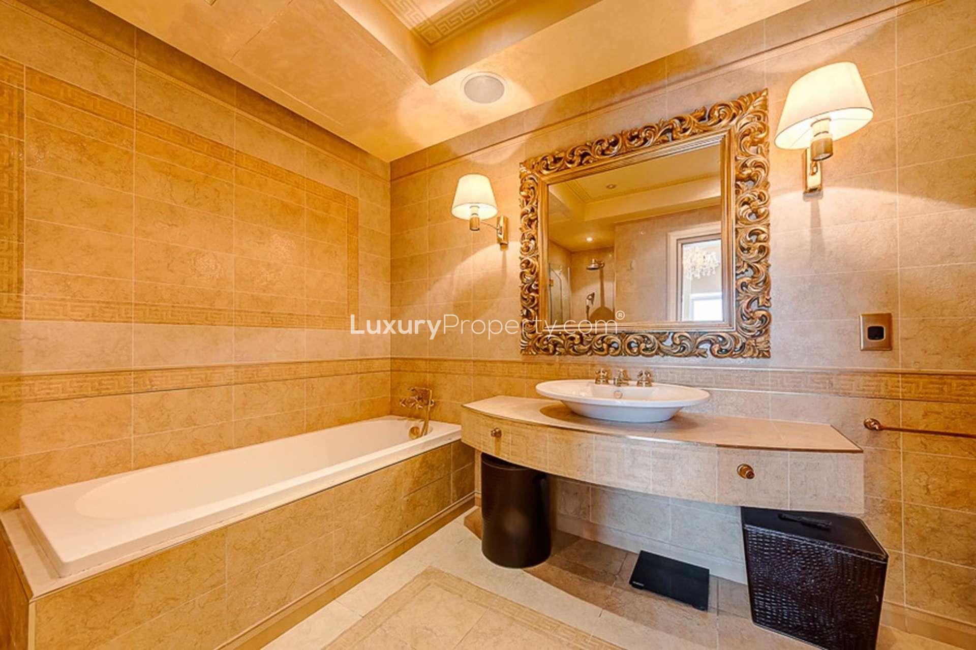 "Spacious balcony with marina and Atlantis views at Tiara Residences, Palm Jumeirah apartment.",Luxurious bathroom in Tiara Residences apartment, featuring elegant design and modern fixtures
