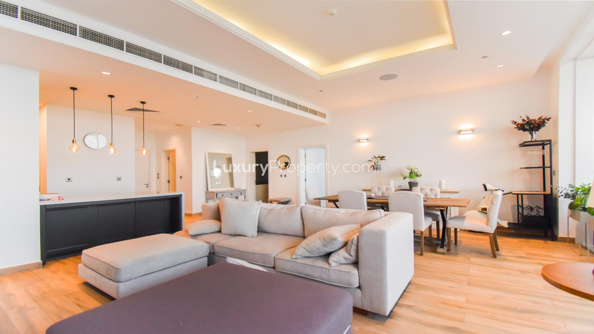 Modern bathroom vanity in Tiara Residence apartment, Palm Jumeirah, with elegant mirror and decor.