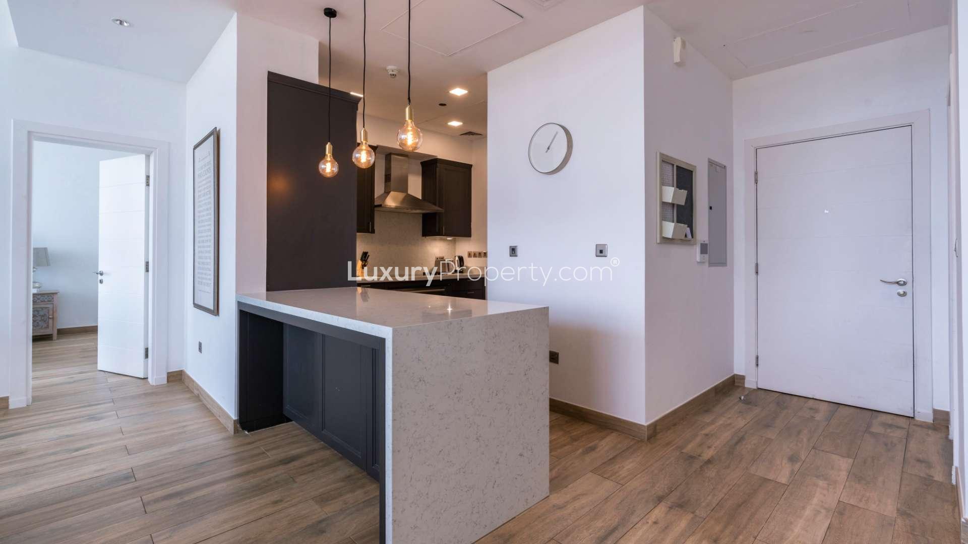 Modern open-plan living area in Tiara Residences apartment, Palm Jumeirah, with harbour views