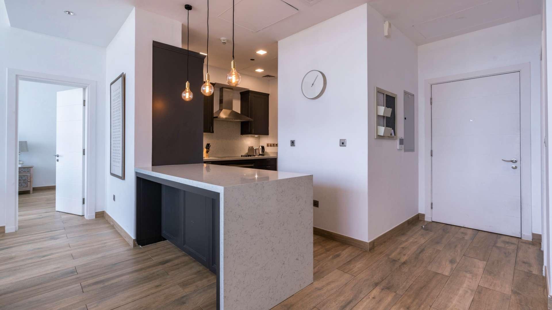 Modern open-plan living area in Tiara Residences apartment, Palm Jumeirah, with harbour views