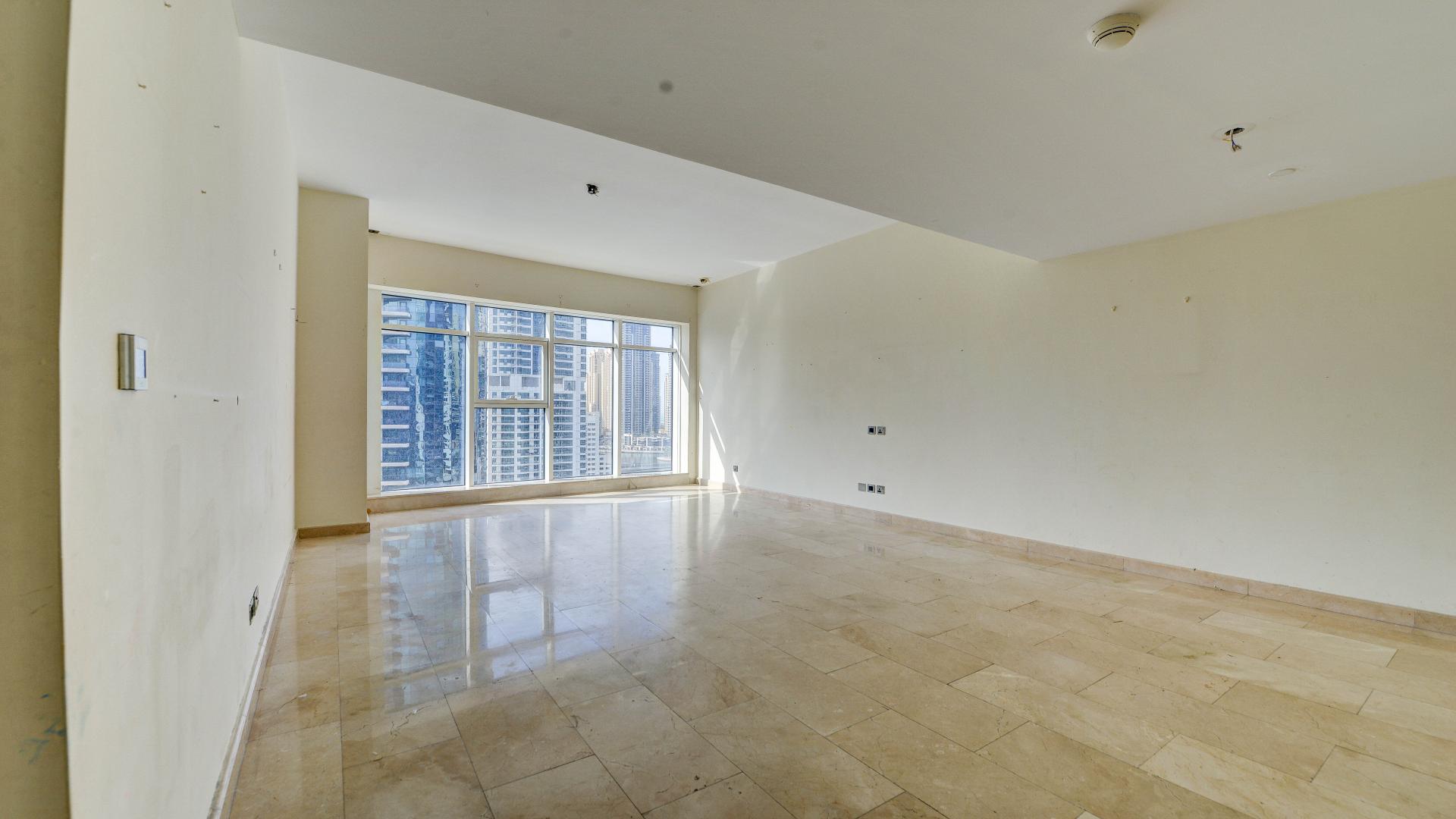 Luxurious living room in Trident Bayside apartment, Dubai Marina, with elegant decor and lighting.
