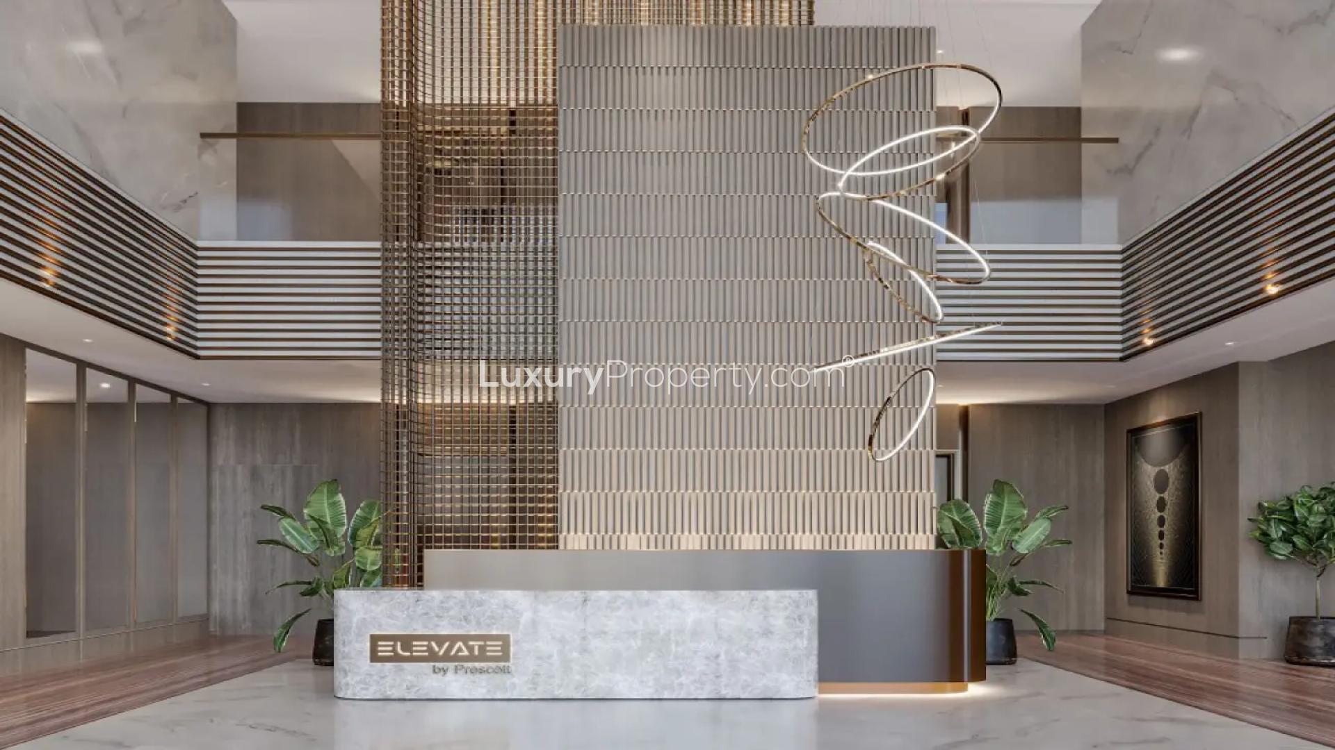"Modern apartment building facade at Elevate by Prescott, Arjan, with illuminated balconies.","Elegant lobby in Elevate by Prescott, Arjan, showcasing modern design and luxury details.",Modern kitchen in 2-bedroom apartment, Elevate by Prescott, Arjan. Stylish design and amenities