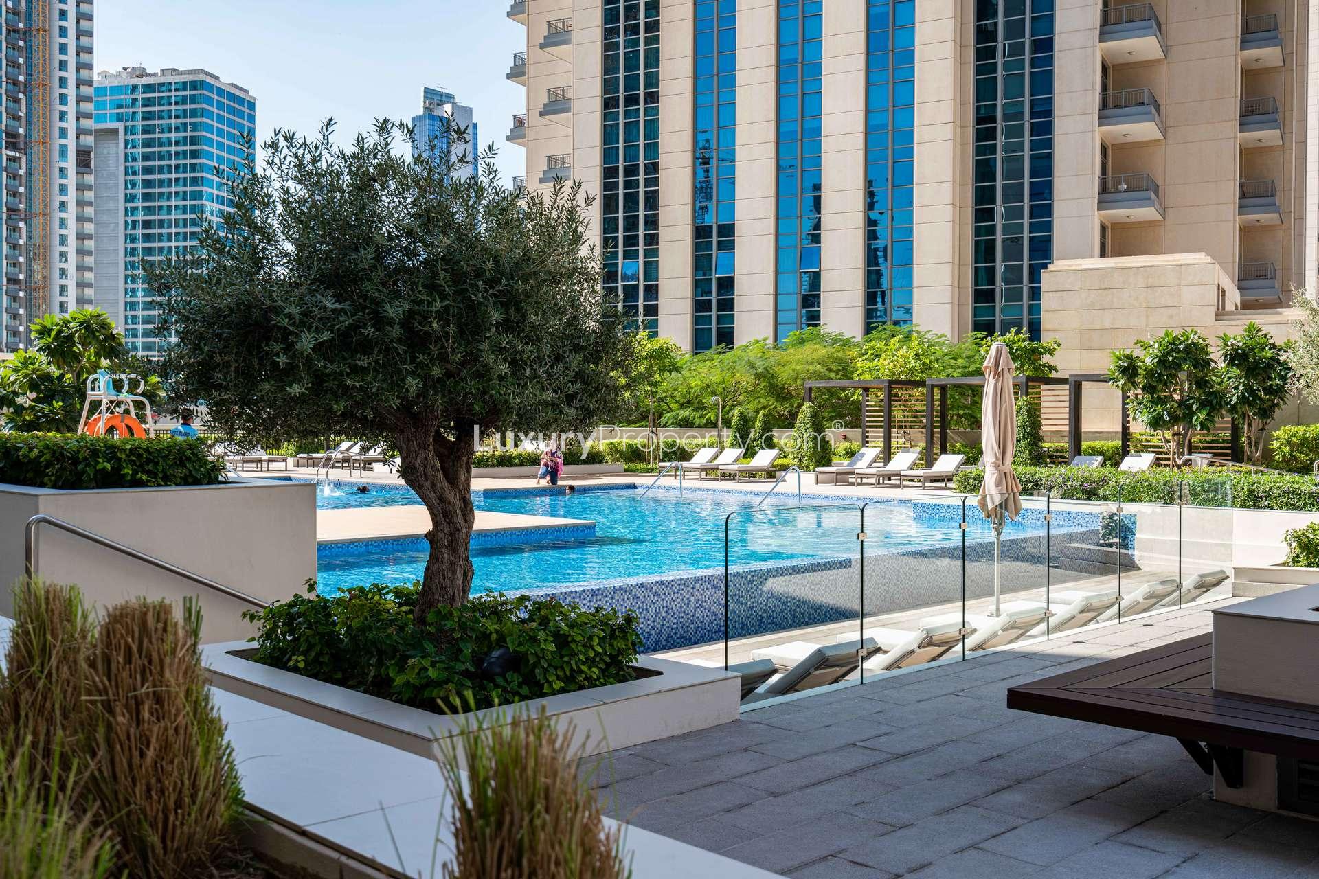 Modern living room in Vida Residence Downtown Dubai apartment with city view balcony