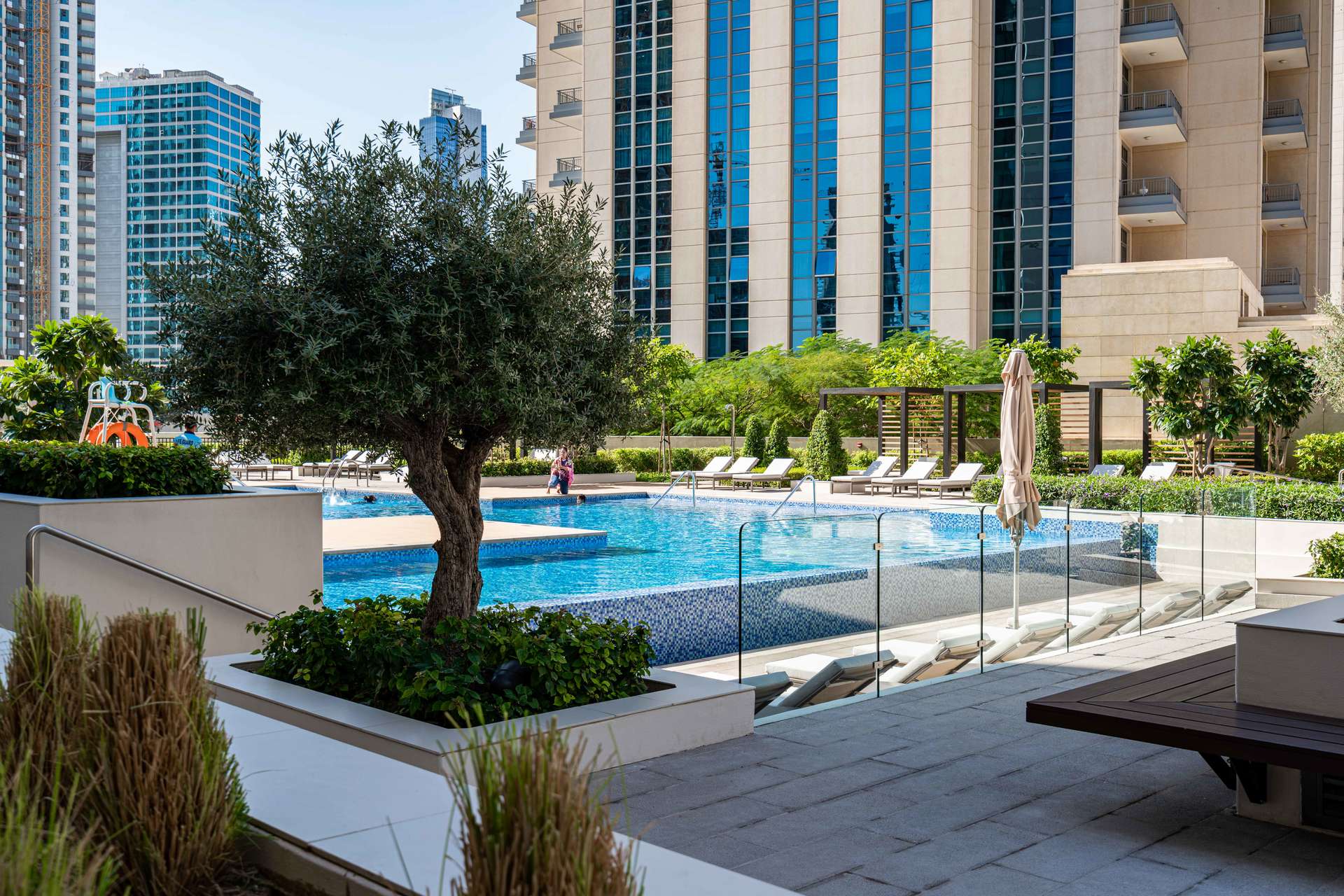 Modern living room in Vida Residence Downtown Dubai apartment with city view balcony
