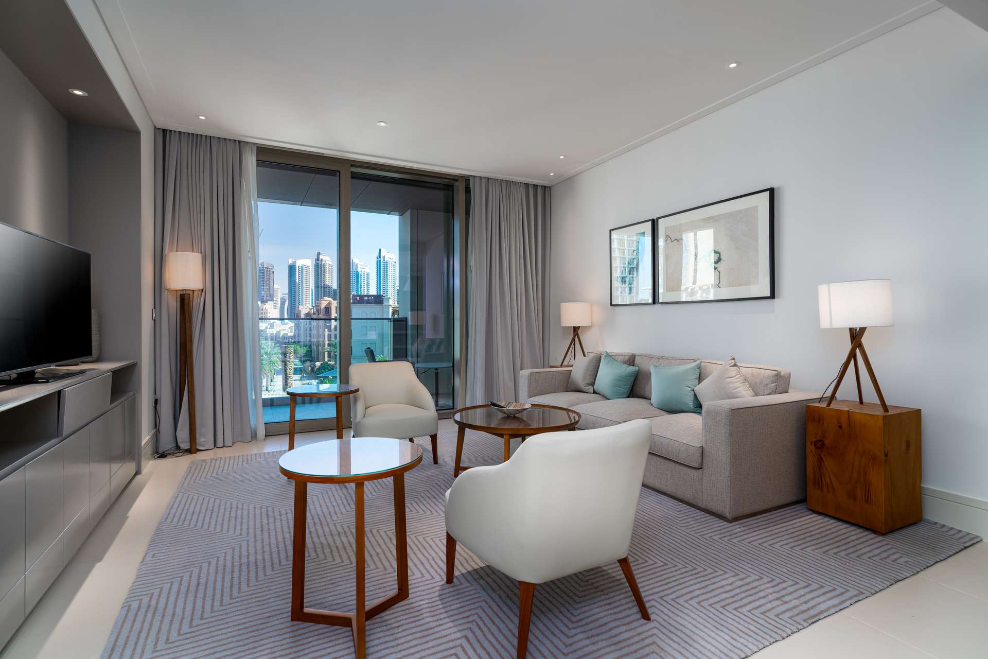 Modern living room in two-bedroom apartment, Vida Residence Downtown, Dubai, with city view
