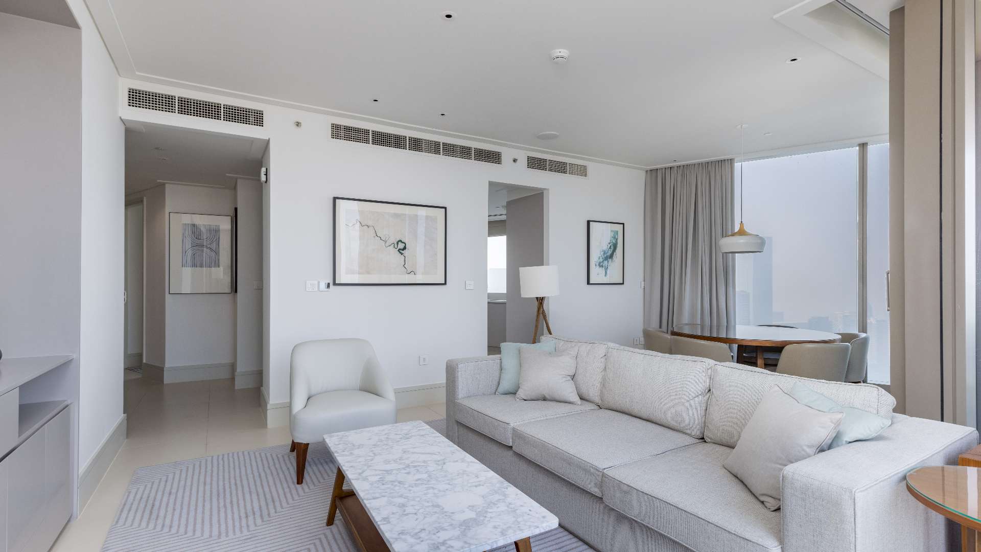 Modern bathroom and bedroom in Vida Residences apartment, Downtown Dubai, featuring stylish decor