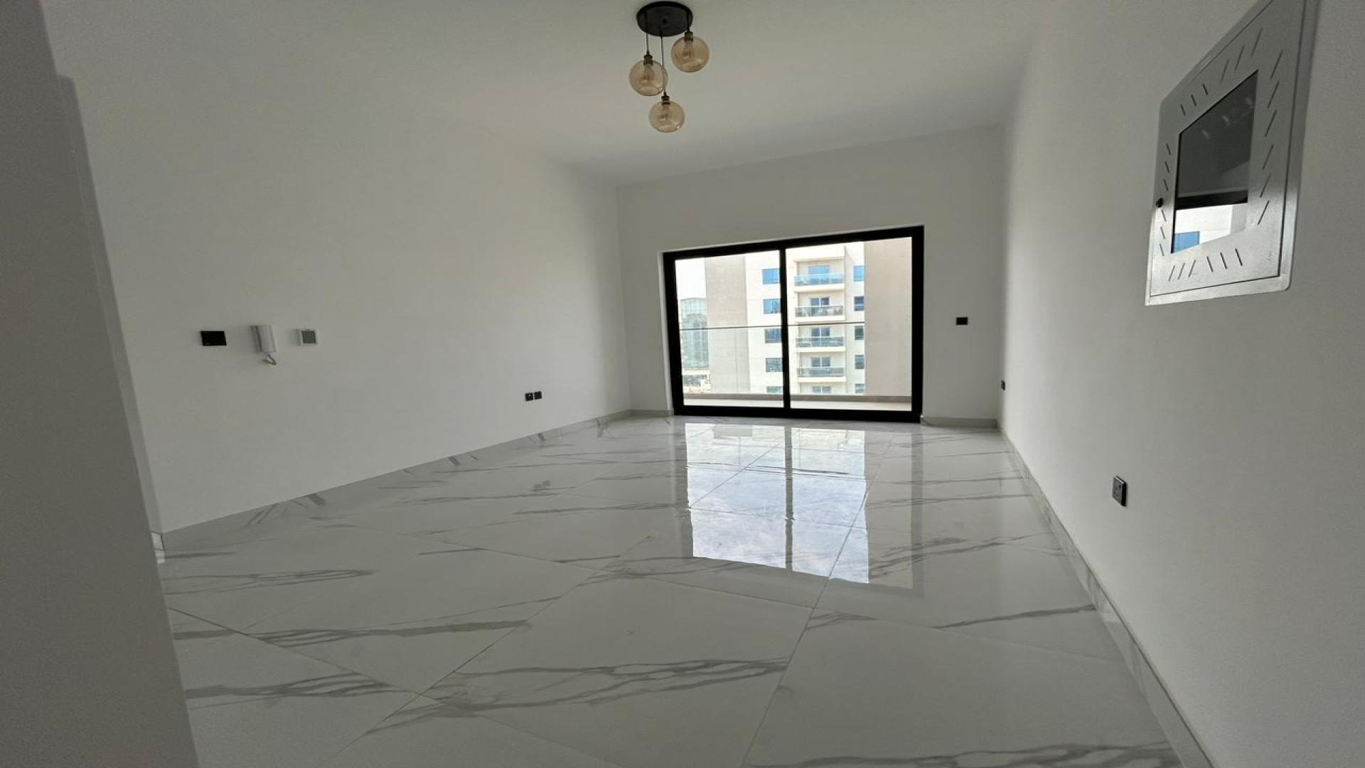 "Balcony view of Gardenia Livings apartment overlooking tennis court and community area in Arjan.",Brand-new 2-bedroom corner unit apartment interior with large window, Arjan, Gardenia Livings