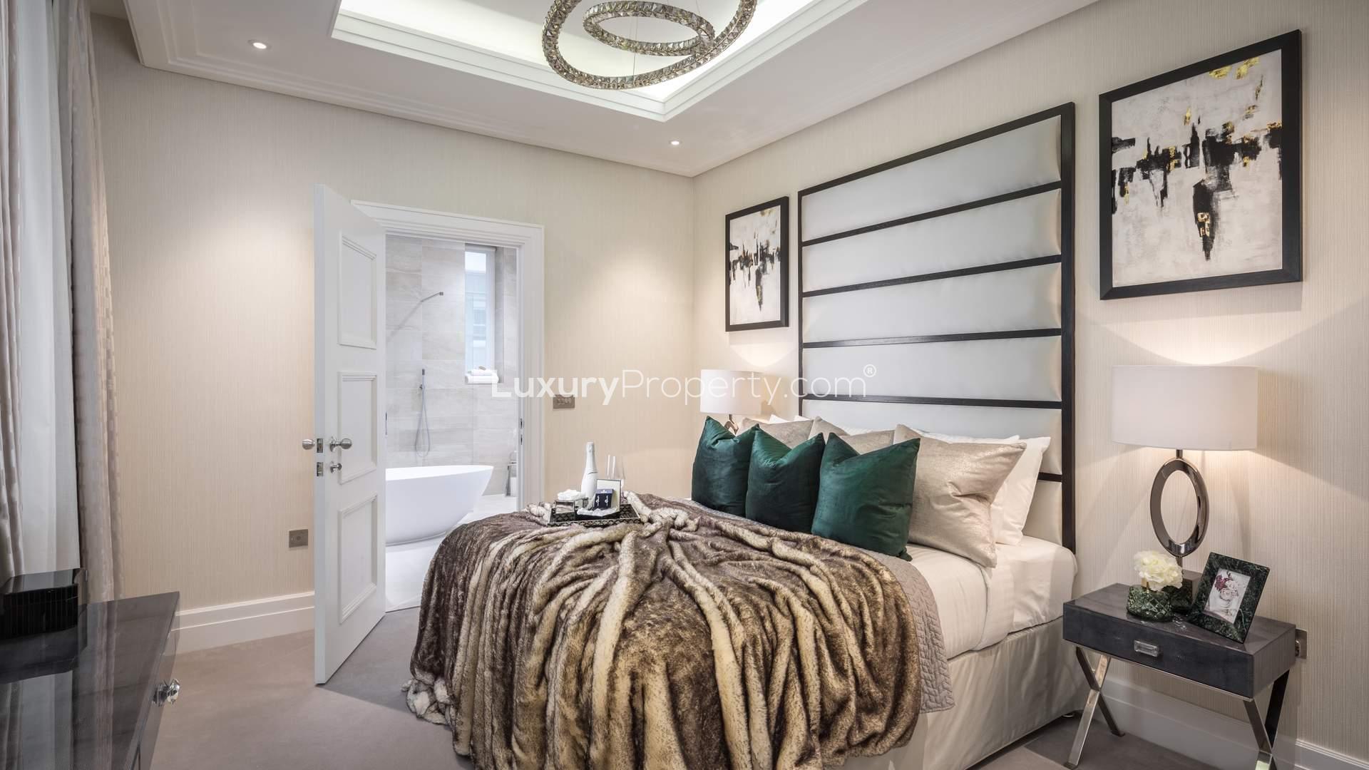 Exterior view of Atkinson House apartment overlooking lush greenery in Wimbledon Hill Park, London