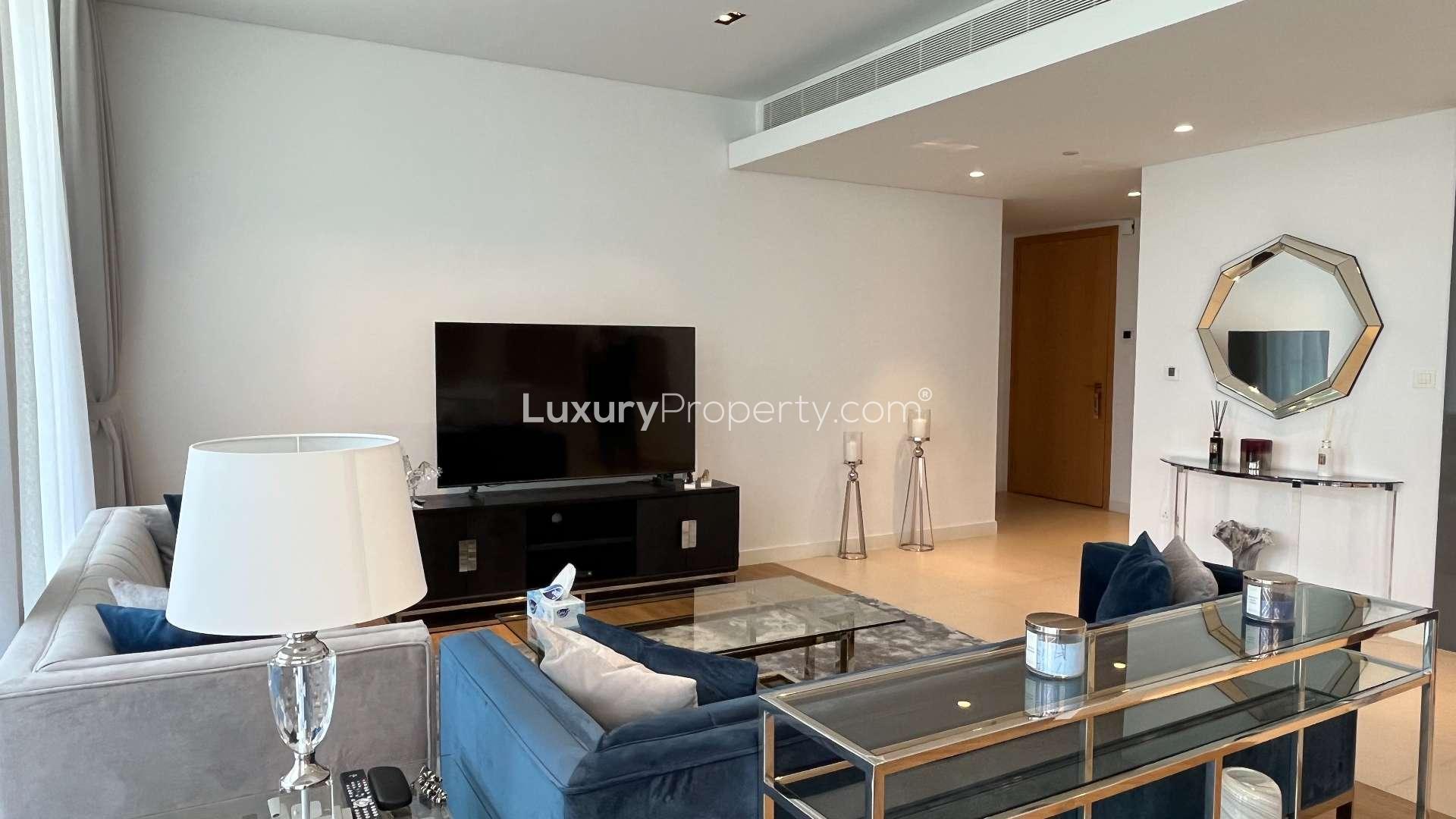 Modern kitchen in Bluewaters Residences apartment for rent, featuring sleek white cabinetry