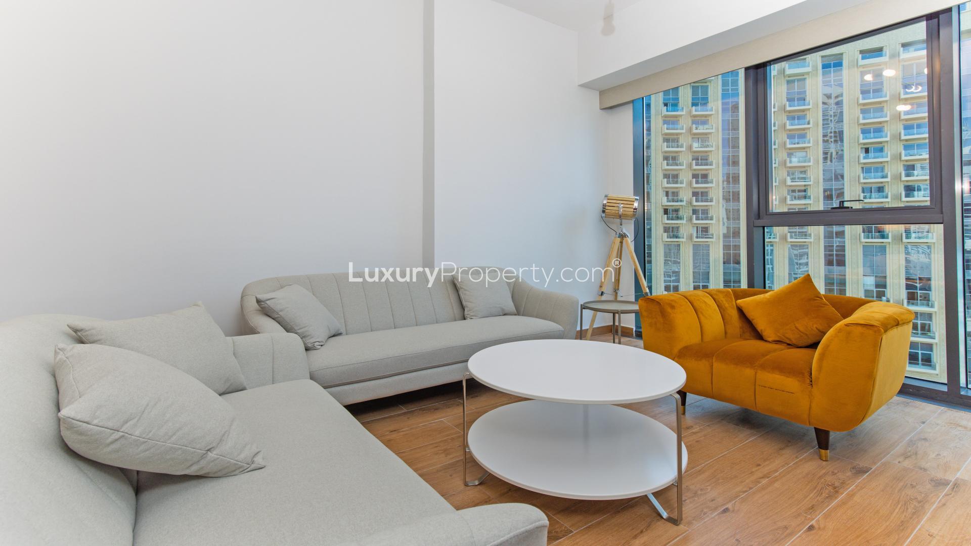 Apartment view of Dubai Marina with yachts and skyscrapers along Marina Walk