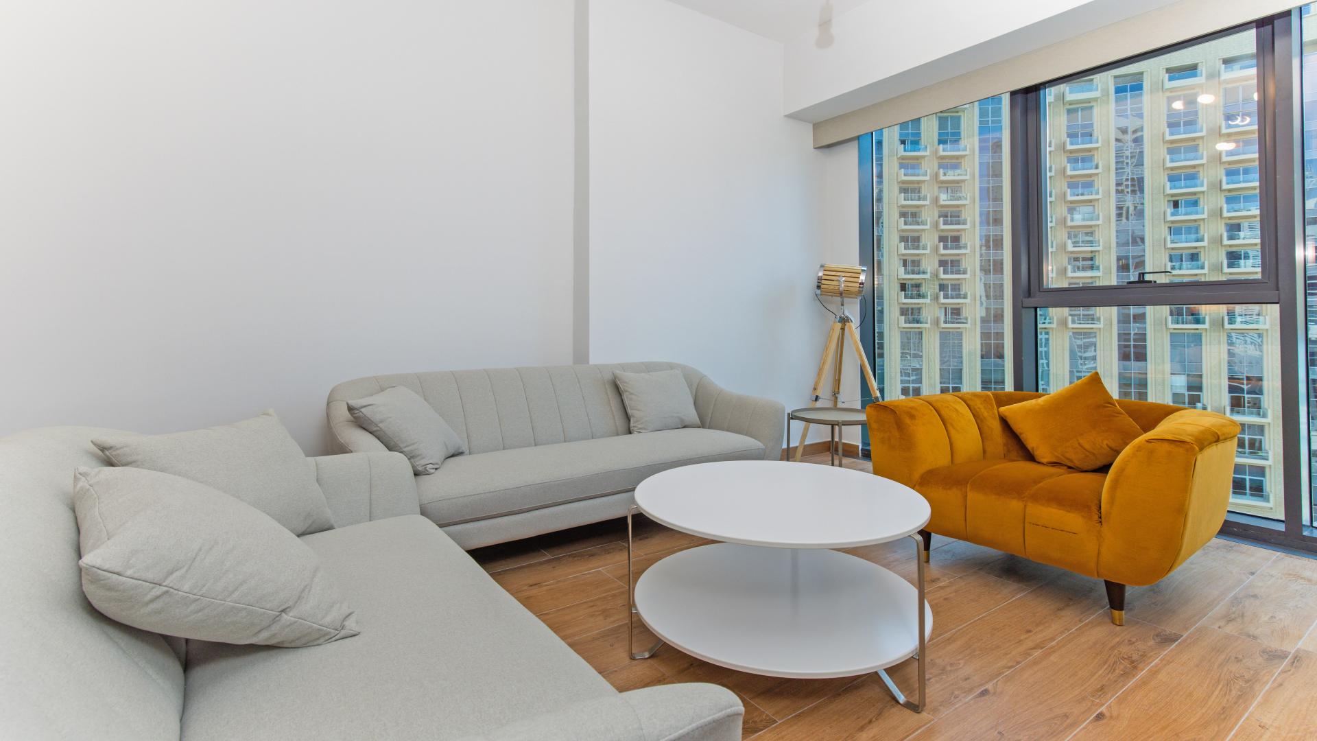 Apartment view of Dubai Marina with yachts and skyscrapers along Marina Walk