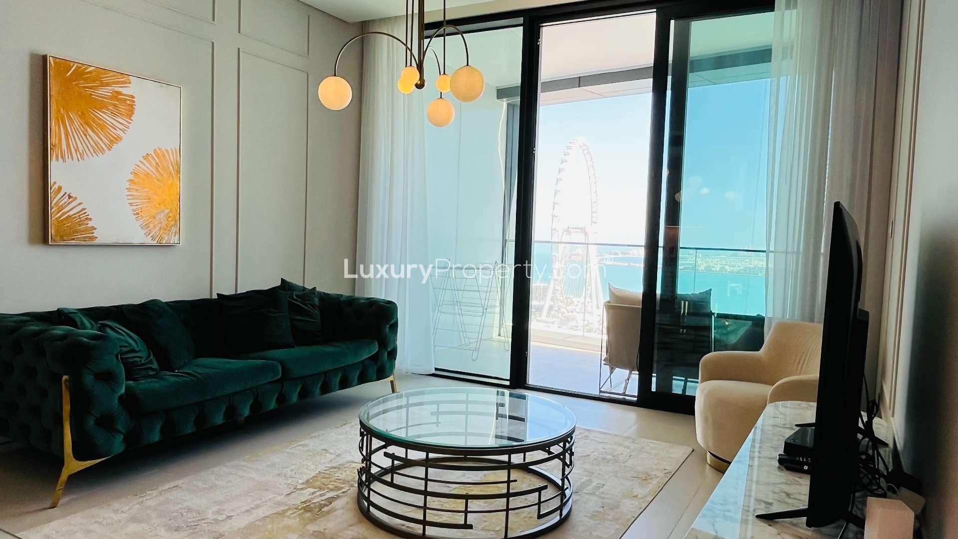 "Stunning sea view from modern apartment in Address JBR, Jumeirah Beach Residence.",Modern JBR apartment living room with sea view, elegant decor, and large windows