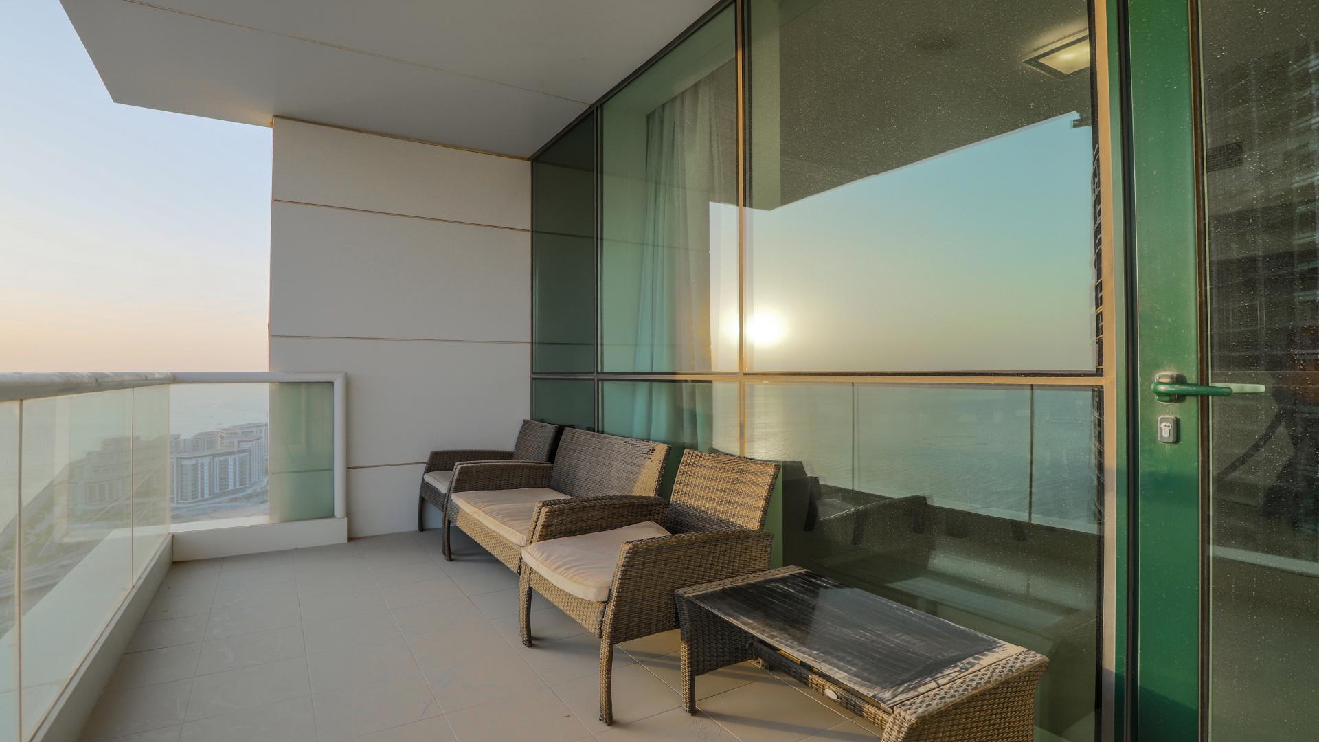 "Spacious living room in two-bedroom apartment, Al Bateen Residences, Jumeirah Beach Residence, sea views.",Balcony with sea views at Al Bateen Residences, Jumeirah Beach Residence apartment for sale