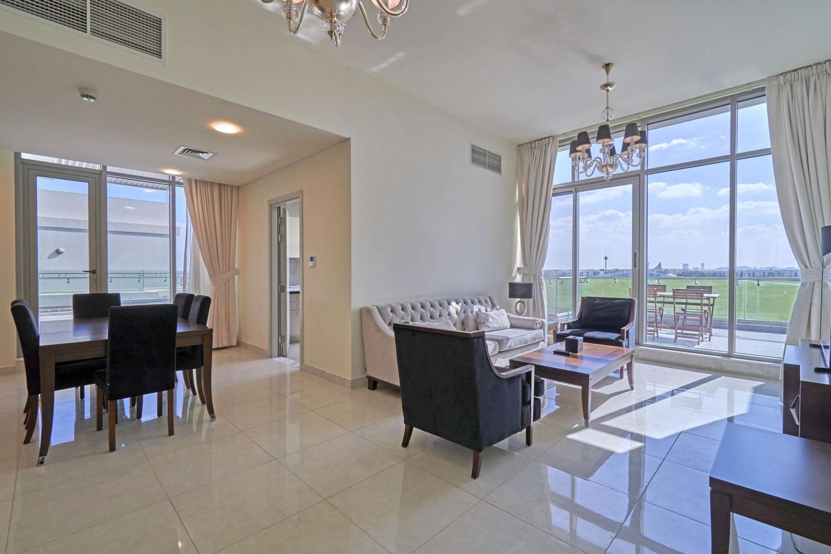 Spacious furnished penthouse living room with large windows in Meydan Avenue, Dubai