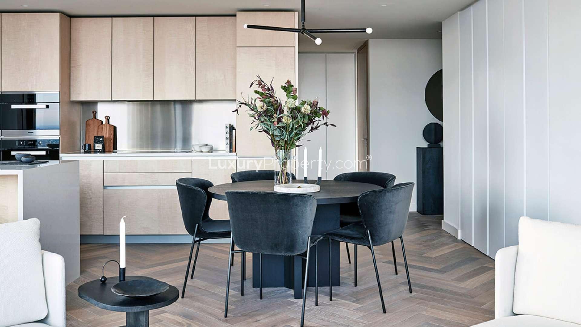 Penthouse living room with city views in Principal Tower, London. Modern decor, open kitchen