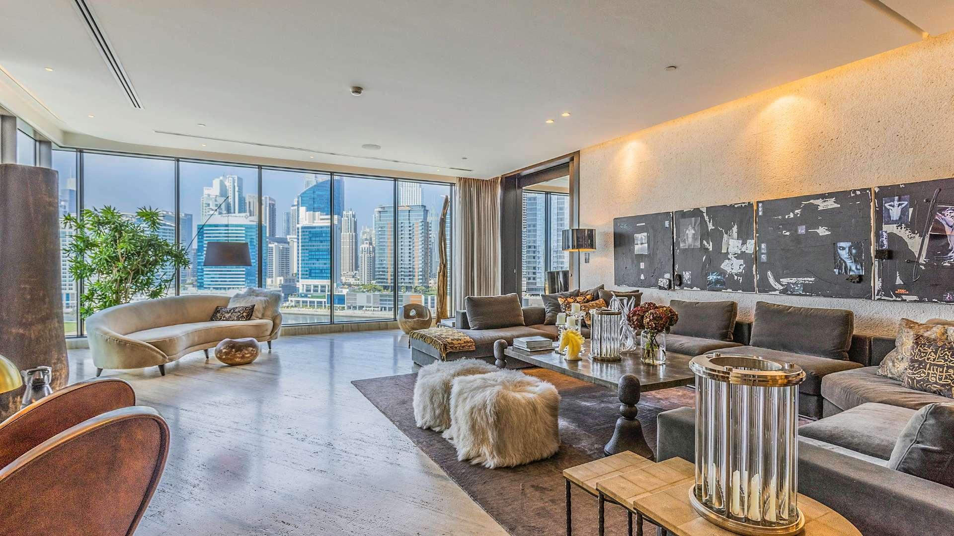 Bespoke furnished penthouse living area with canal view in Volante, Business Bay