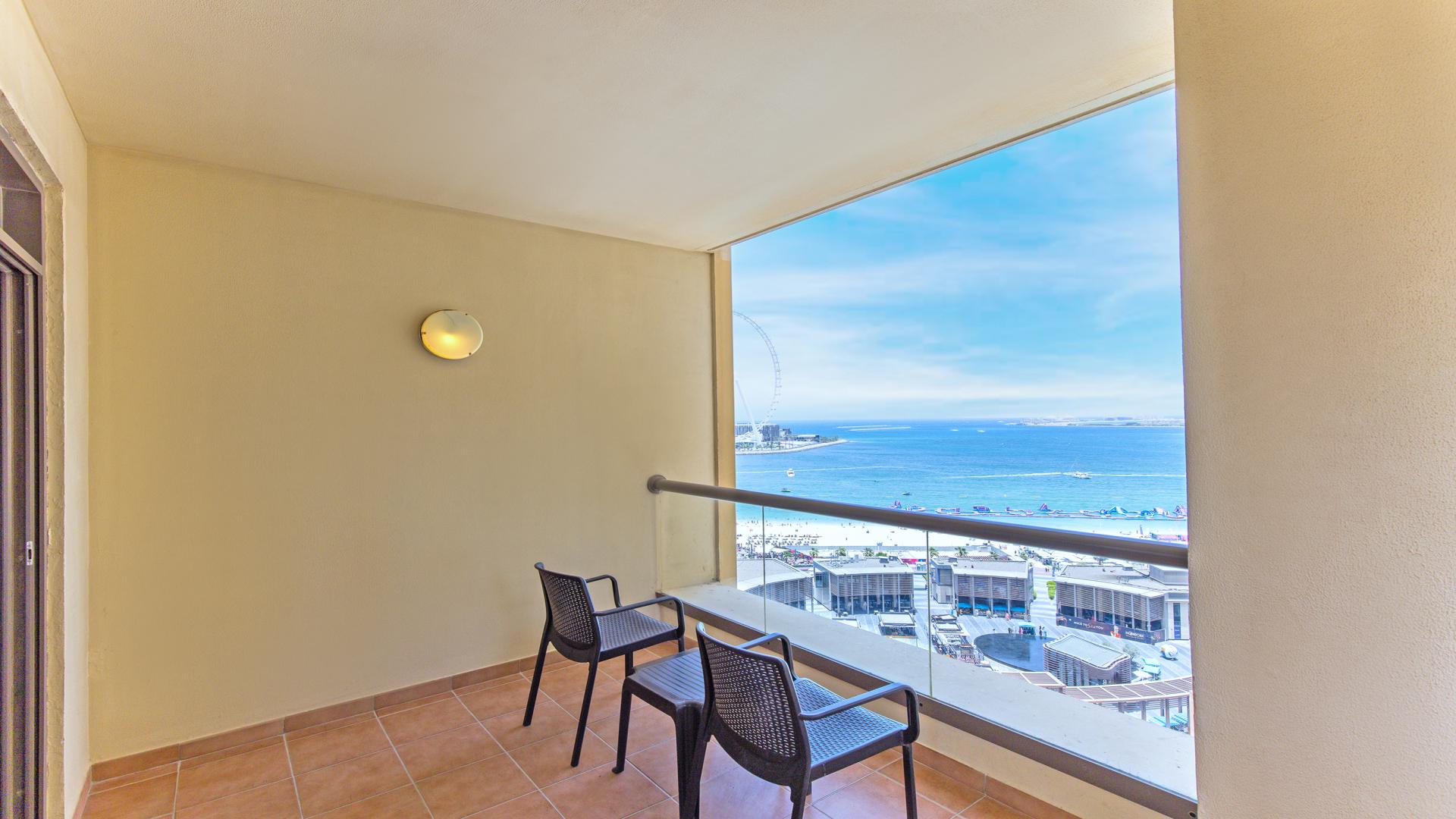 Living room in serviced apartment, Jumeirah Beach Residence, with sea view and modern furnishings