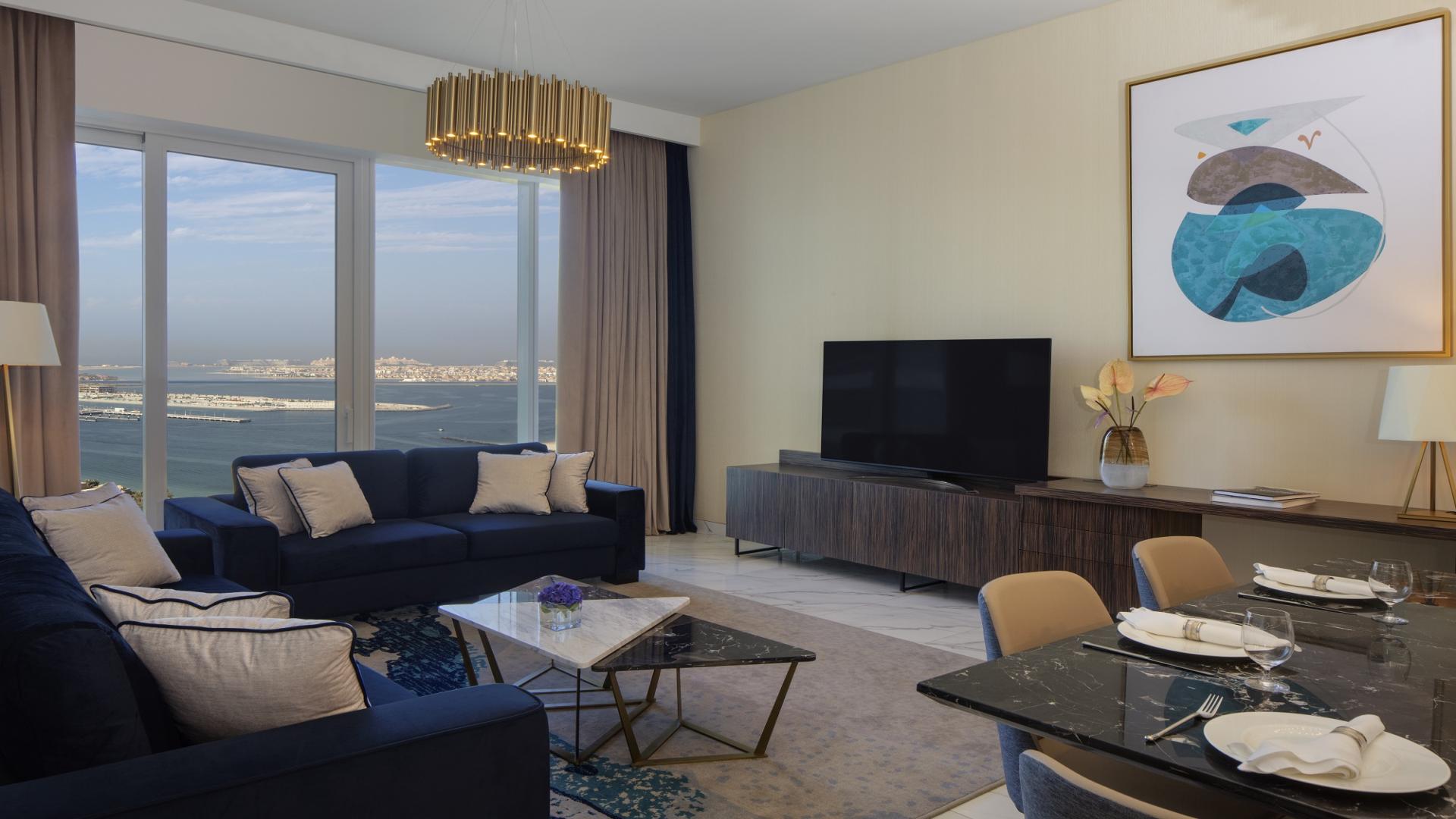 Modern living room and kitchen in Dubai Media City apartment, Avani Palm View Hotel & Suites