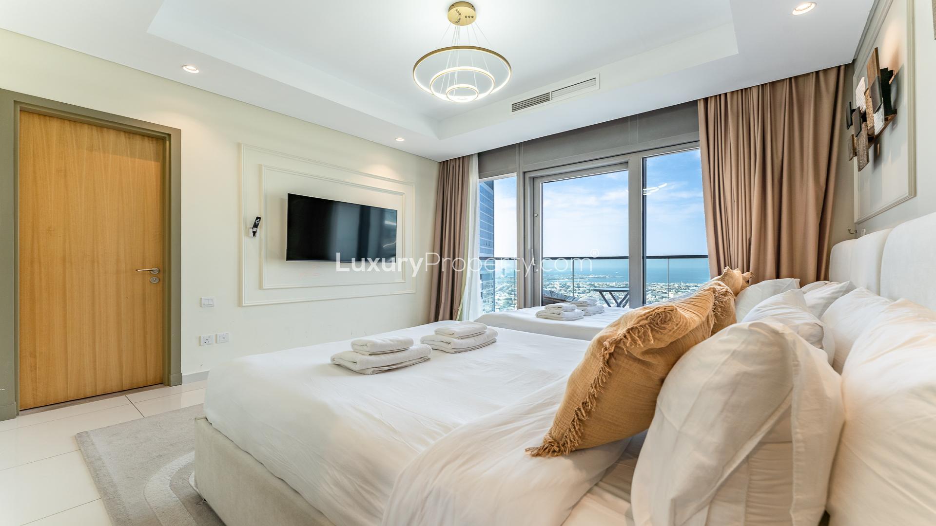 Balcony view from Paramount Tower, Business Bay serviced residence, showcasing city skyline and seating