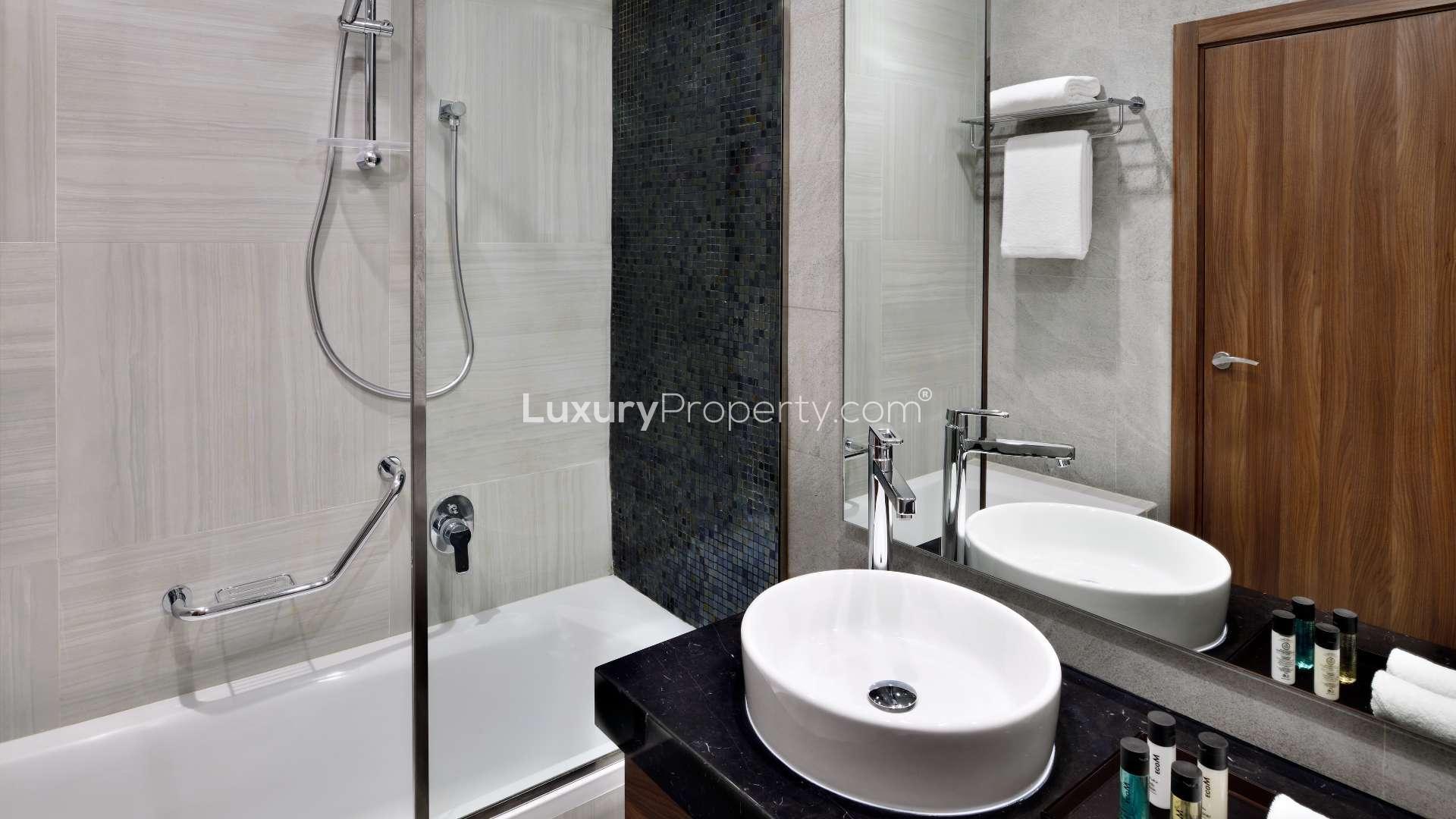Contemporary downtown serviced apartment bedroom with modern decor and natural light