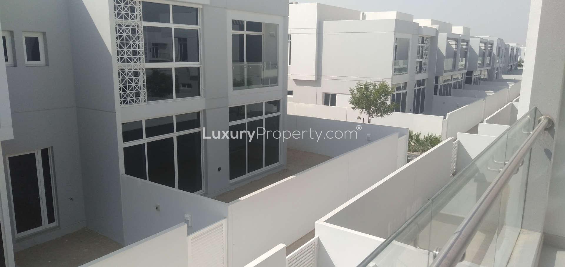 Bright living area with modern windows in Arabella 2 townhouse, Mudon community