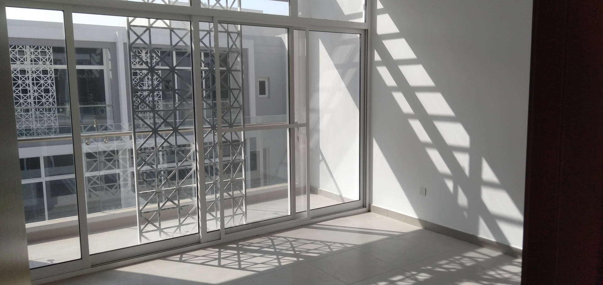 Staircase view with decorative window in Mudon Arabella 2 townhouse for rent