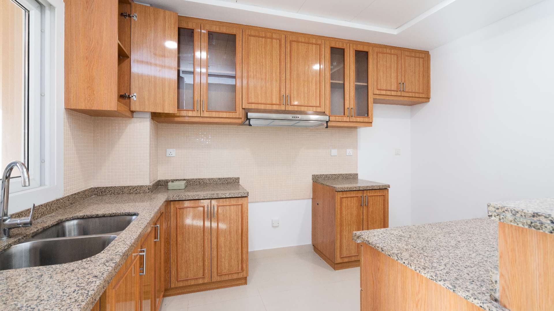 Bright kitchen and living area in Bella Casa townhouse for rent, Serena, Dubai