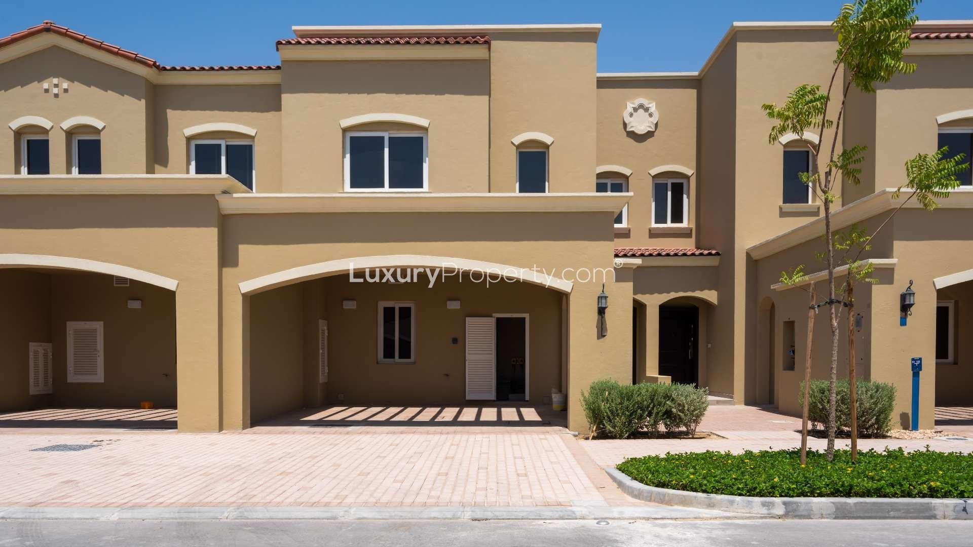 Modern kitchen and staircase in Bella Casa two-bedroom townhouse, Serena community