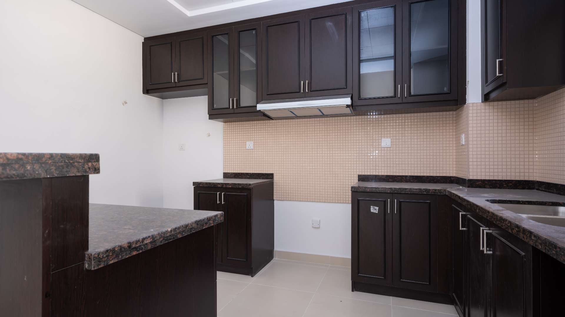 Modern kitchen and living area in Bella Casa townhouse, Serena, available for rent