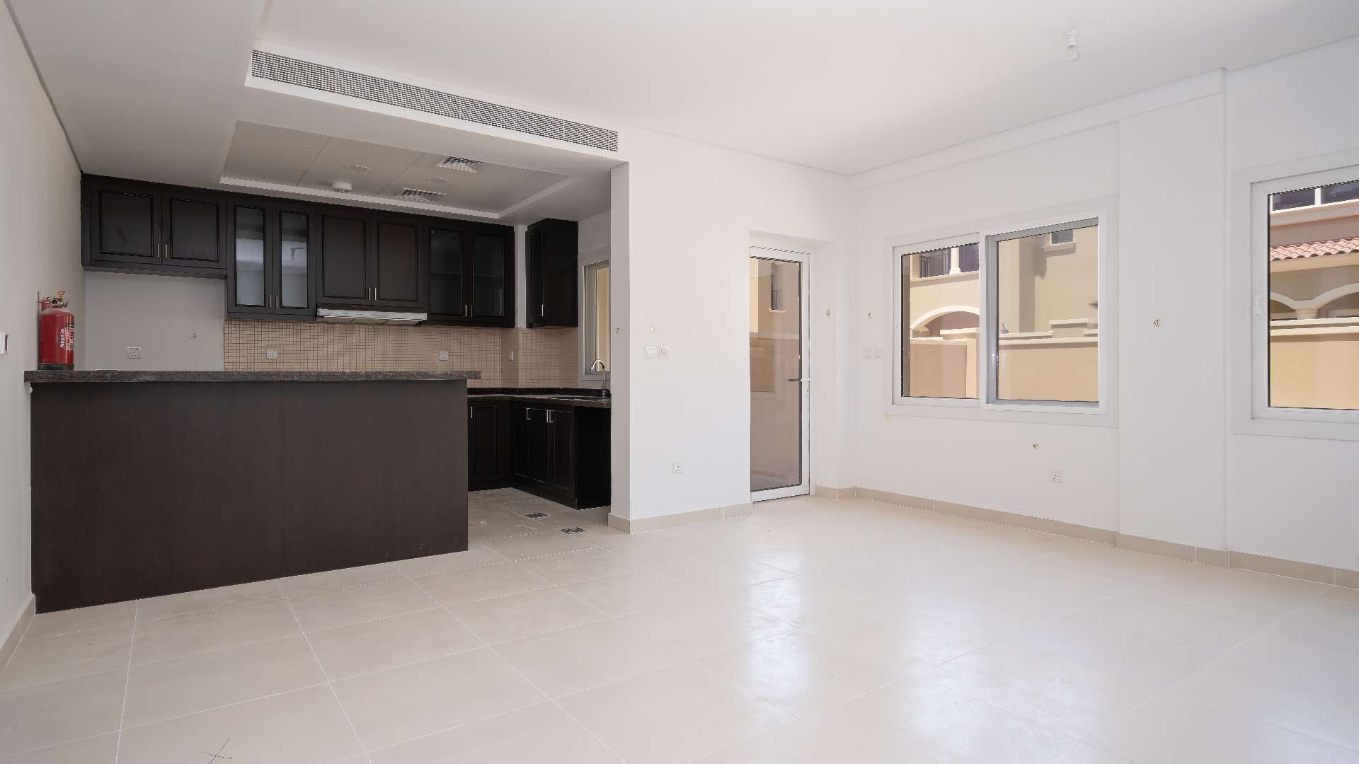 Interior view of 2-bedroom townhouse in Bella Casa, Serena, featuring kitchen and staircase