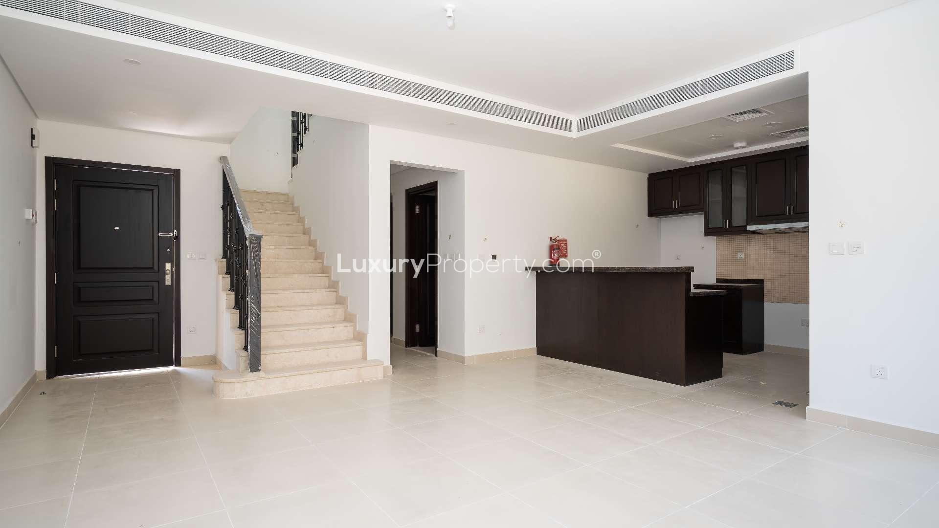 Elegant townhouse exterior in Bella Casa, Serena community available for rent