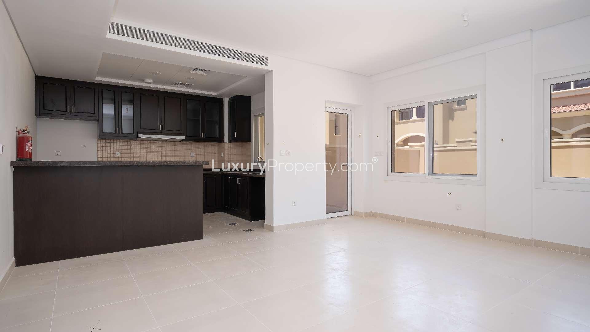 Elegant townhouse interior with staircase and modern kitchen in Bella Casa, Serena