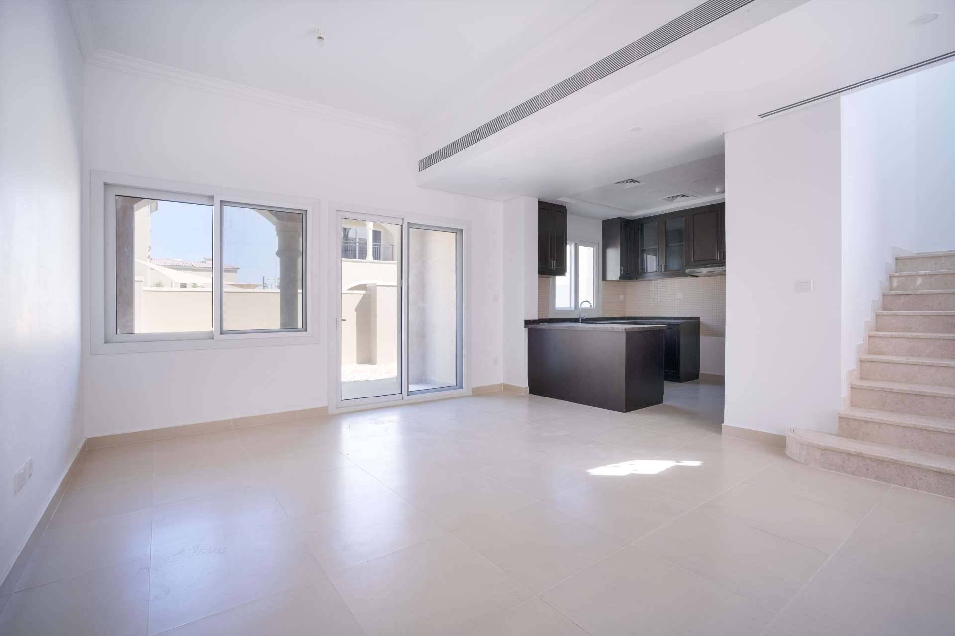 Newly built kitchen in Serena Casa Dora townhouse with modern dark wood cabinets