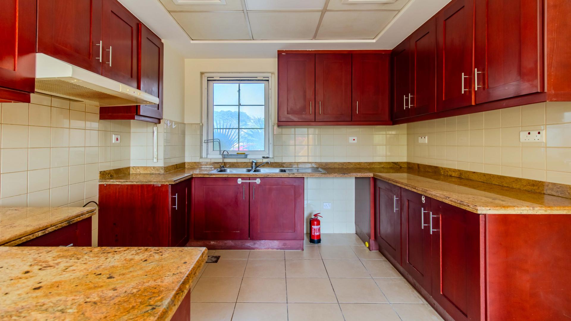 Spacious living room with staircase in Palmera villa, Arabian Ranches, available for rent