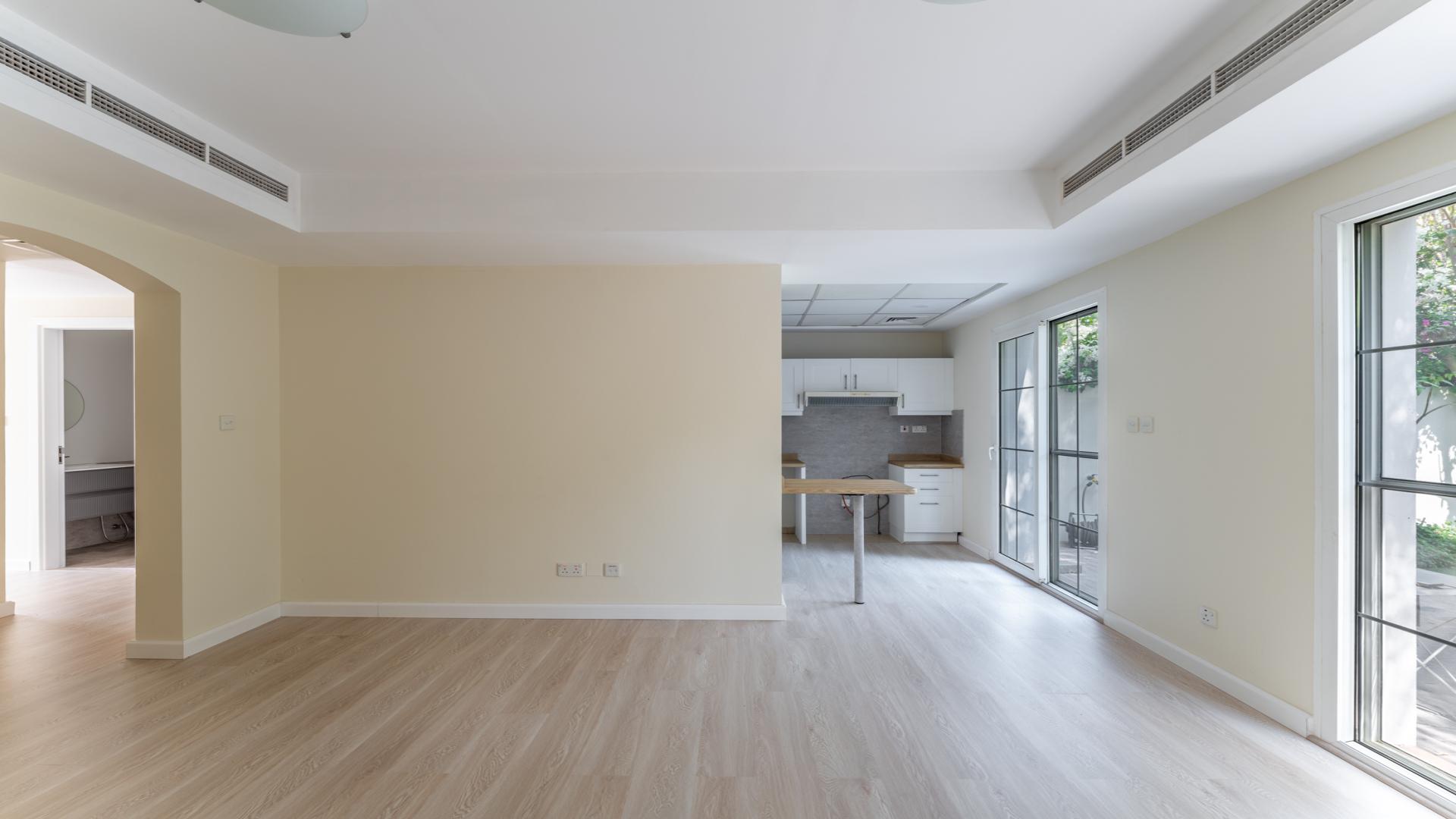 Bright living room with garden view in upgraded 2-bedroom villa, Arabian Ranches