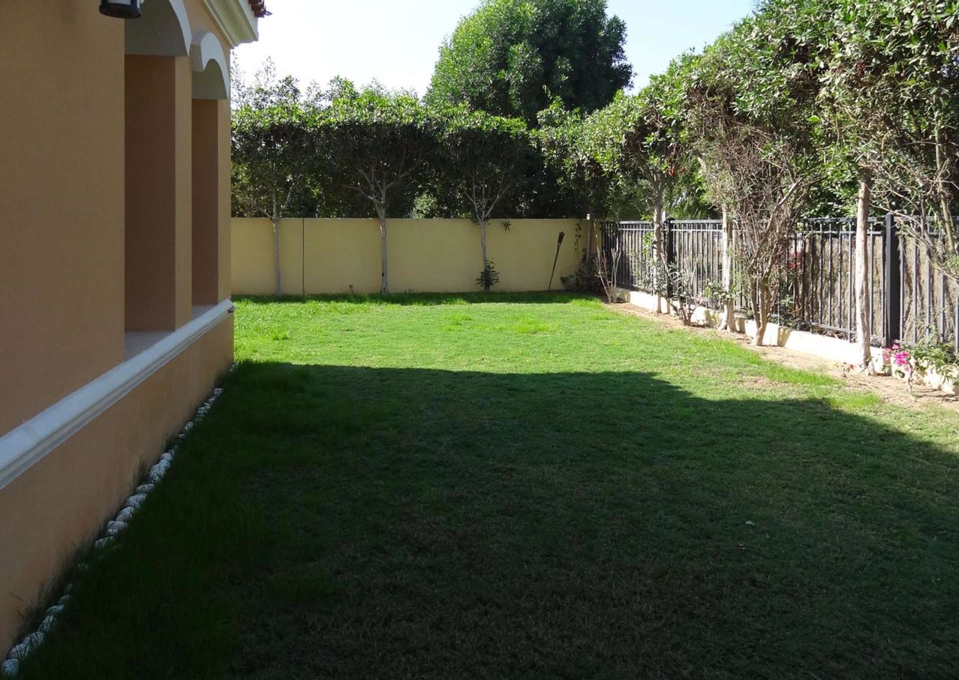Lush green backyard of 2-bedroom townhouse in Palmera 3, Arabian Ranches for rent