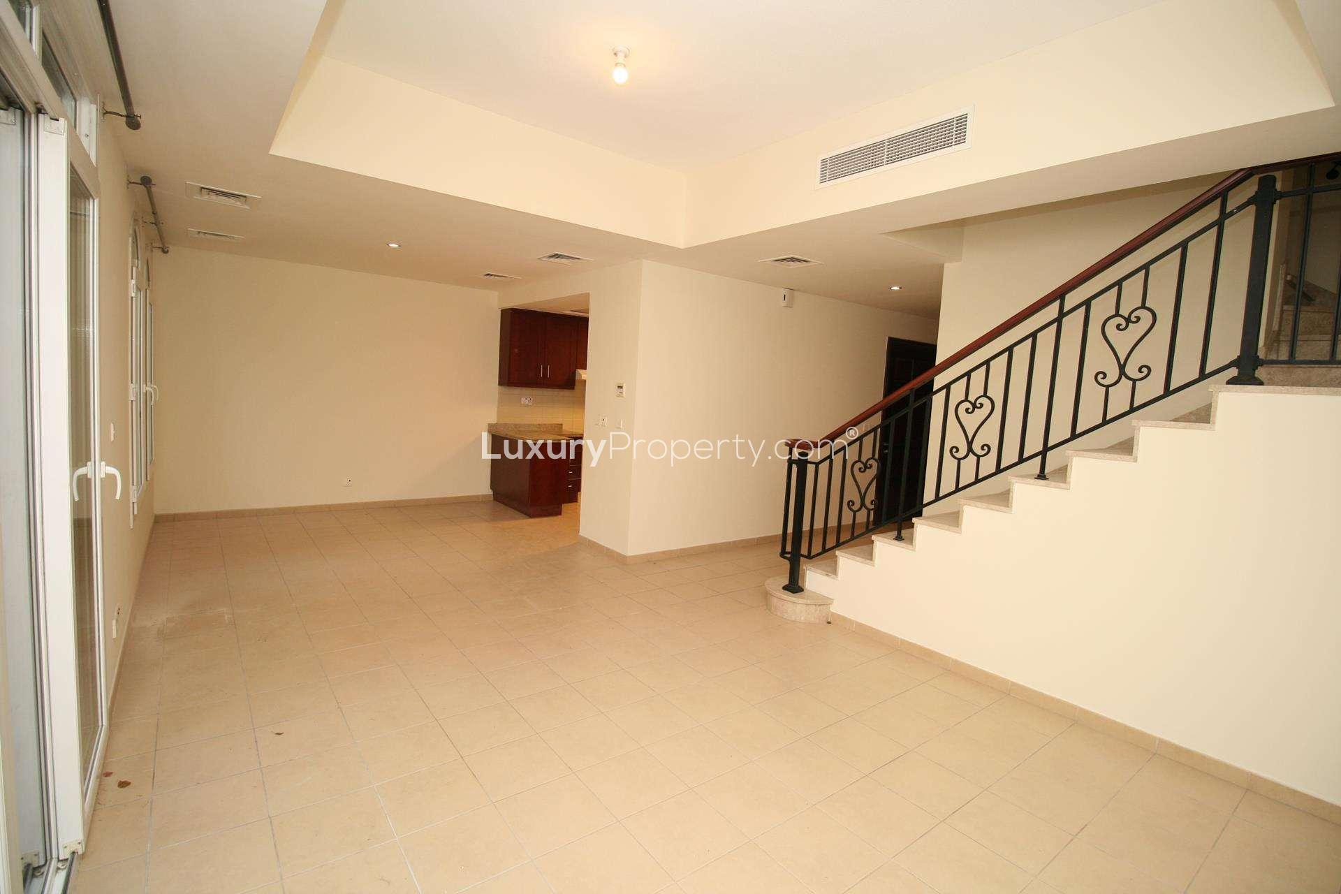 Single row 2-bedroom villa exterior in Palmera, Arabian Ranches community for rent