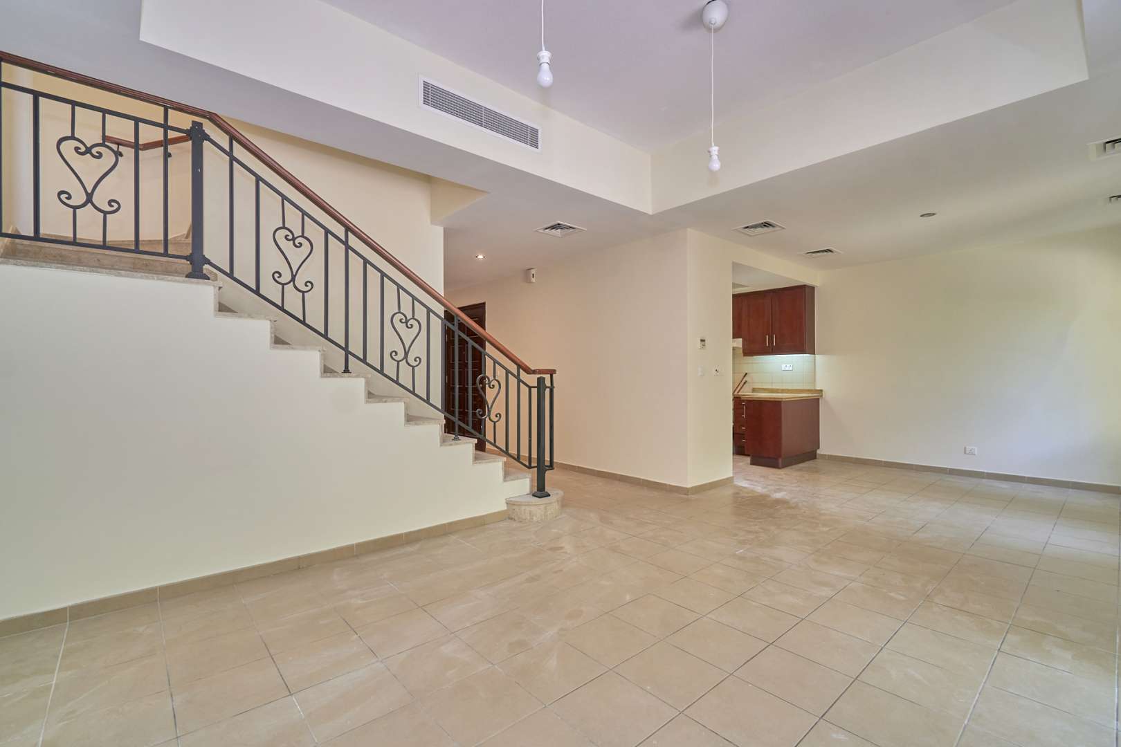 Well-maintained townhouse interior with tiled floors and garden view in Palmera, Arabian Ranches, Dubai
