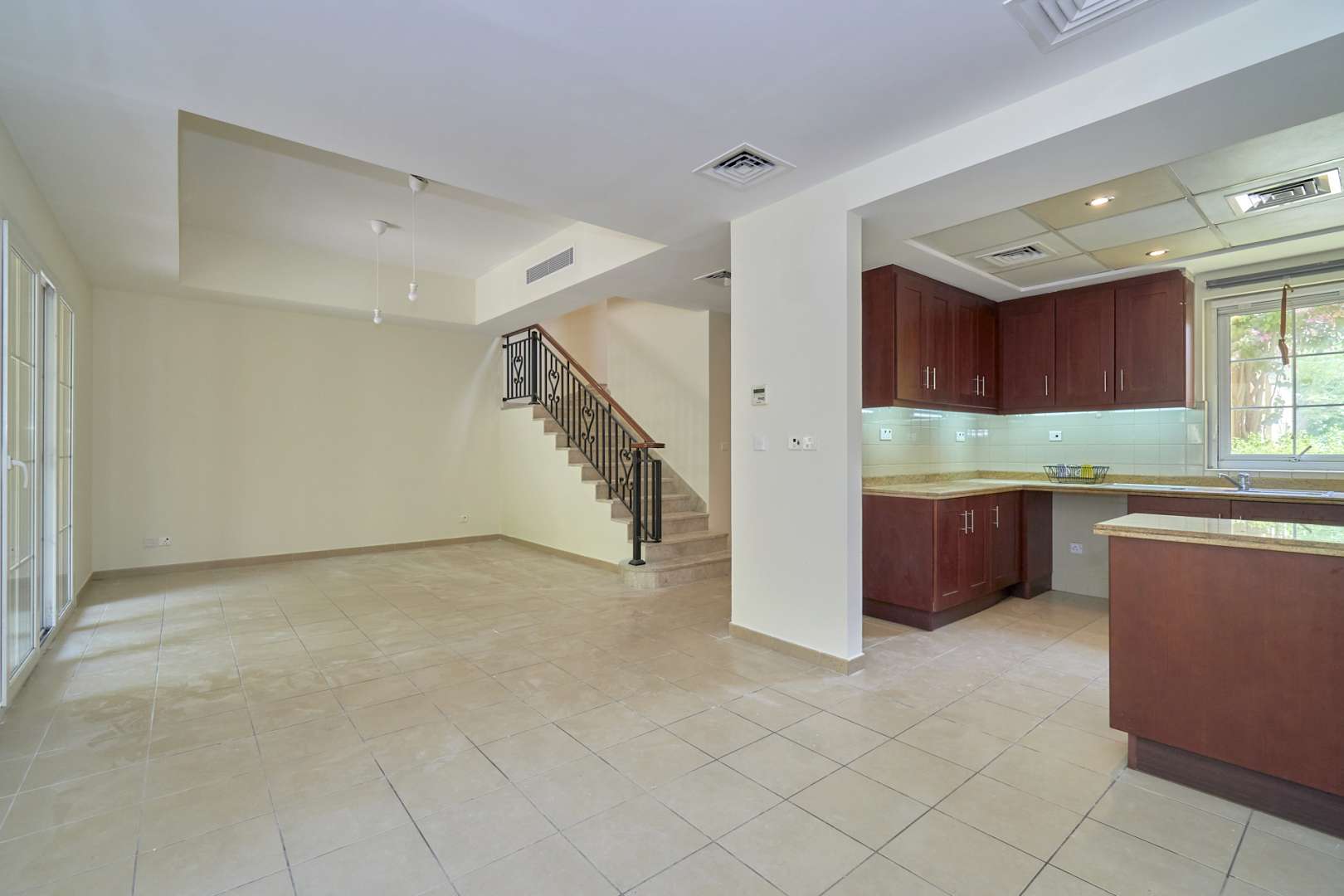 Exterior view of townhouse for rent in Palmera, Arabian Ranches, Dubai, with garage